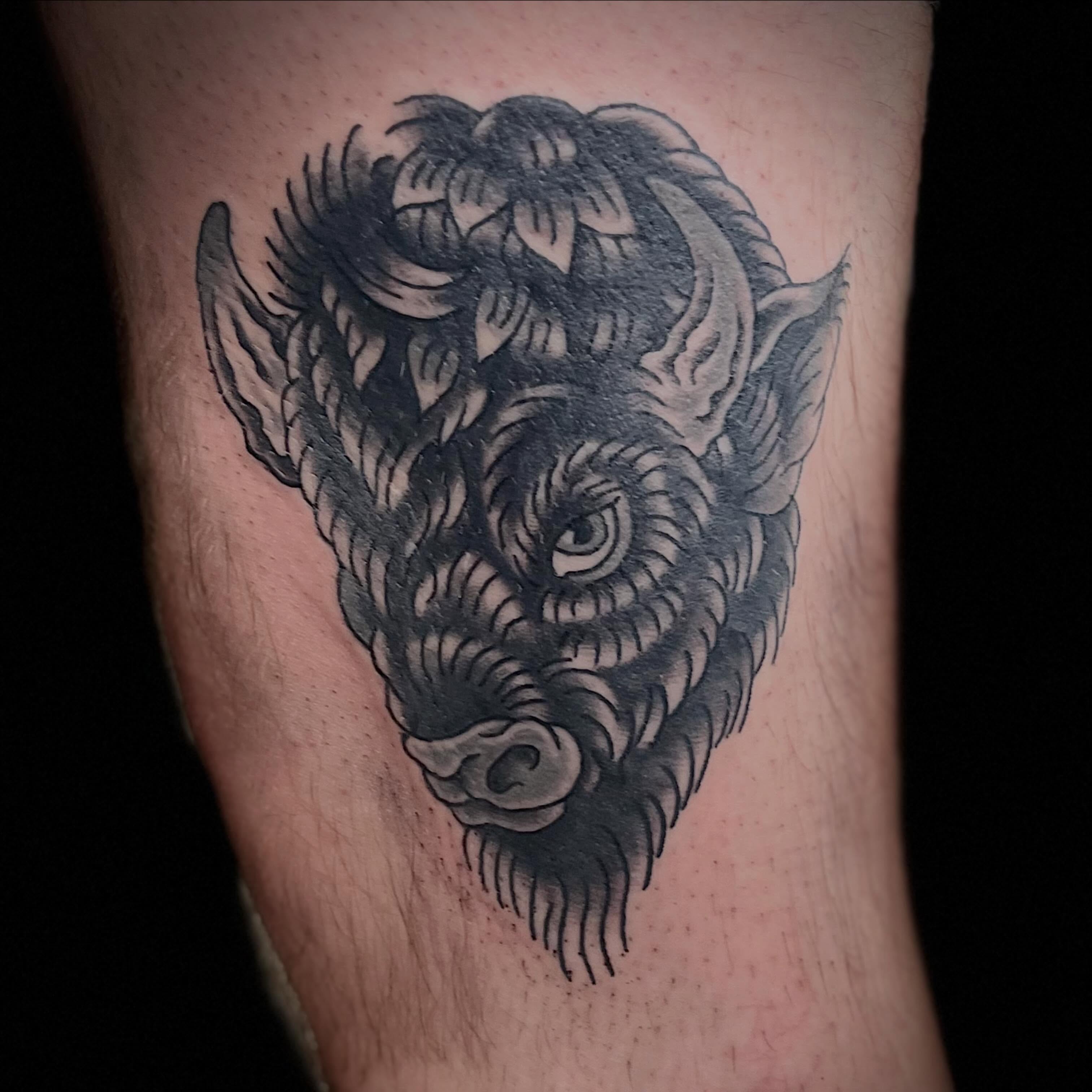 Boar head black and grey tattoo on the forearm by Tyler Howard
