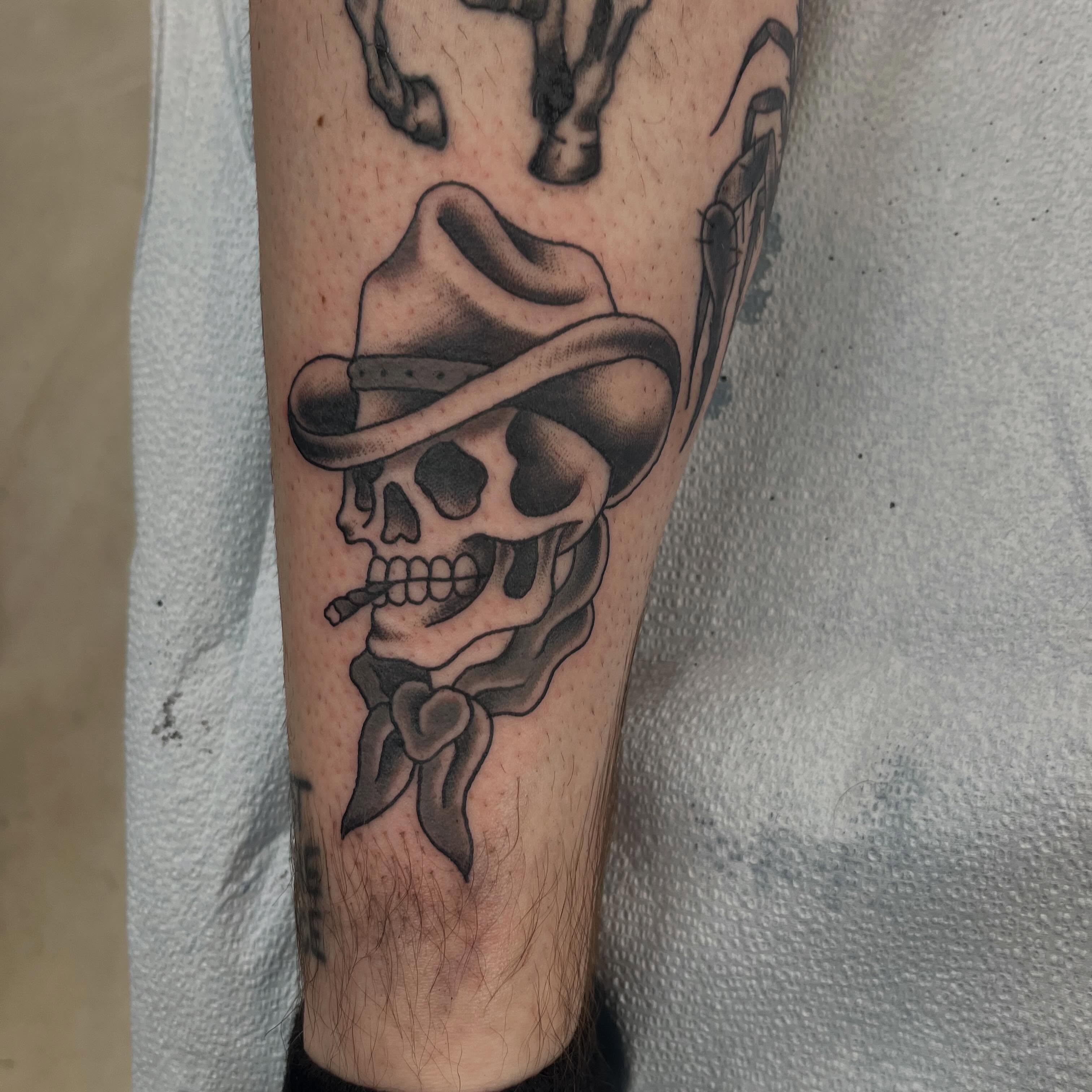 Cowboy skull black and grey tattoo on the forearm by Tyler Howard