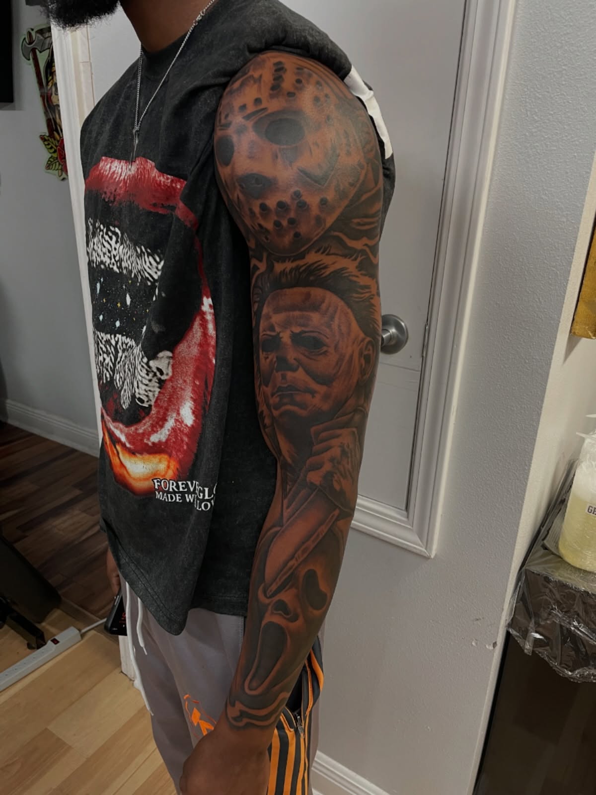 Horror movie characters realism tattoo on the upper arm by Blake