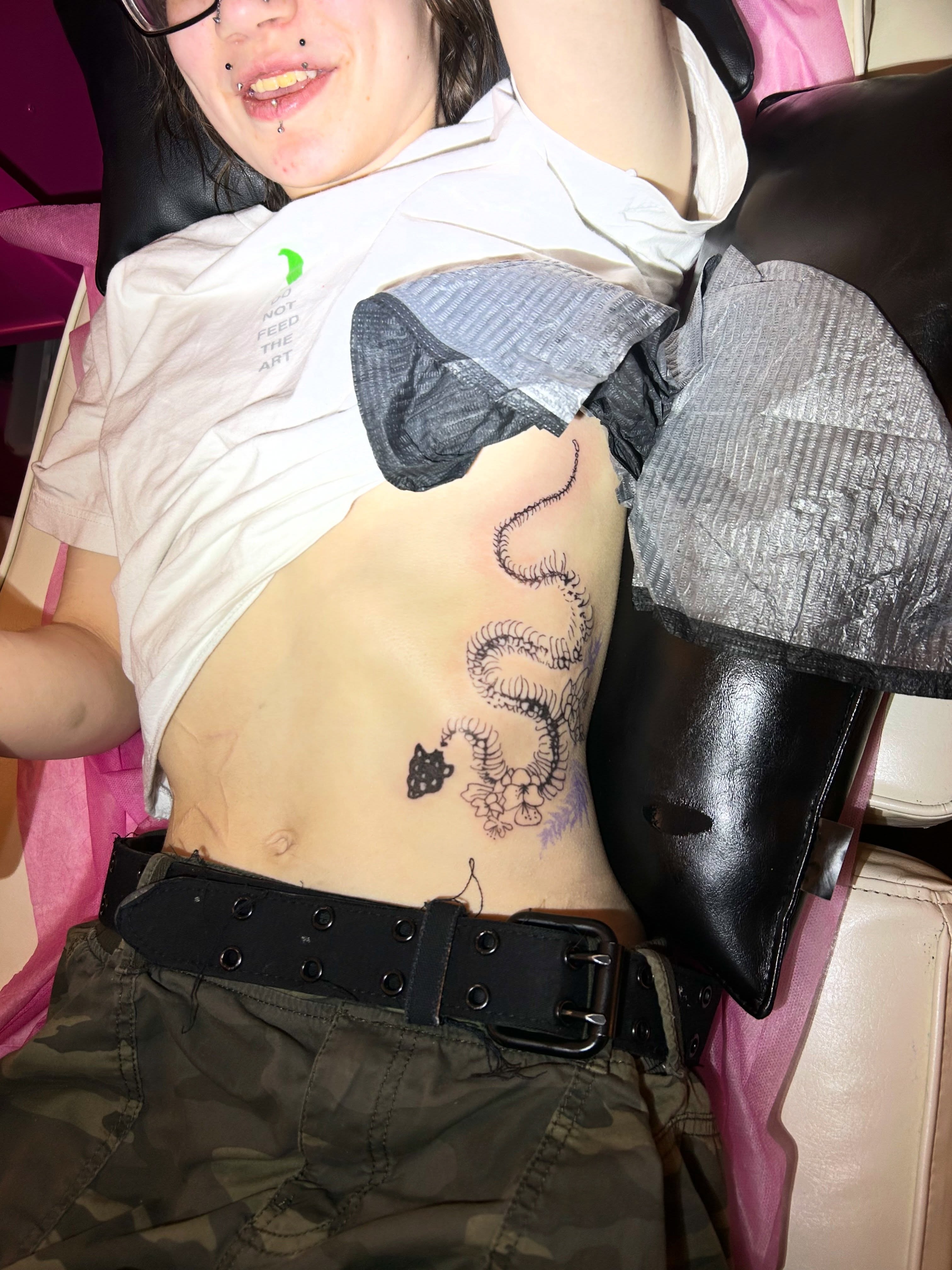 Snake and teacup black and grey tattoo on the chest by Mattie Robinson