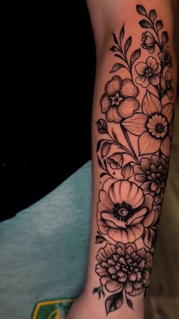 Floral arrangement fine line tattoo by Steve