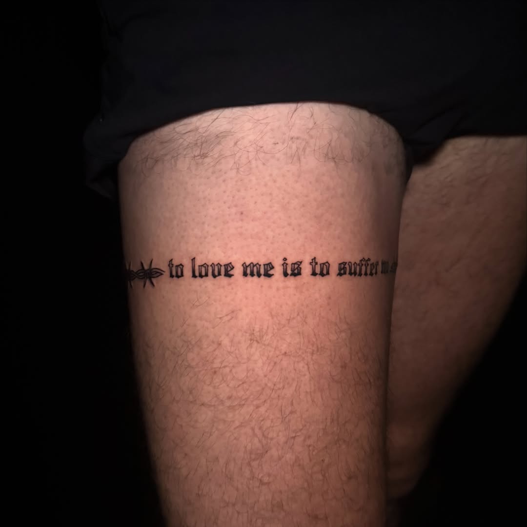 Text lettering script tattoo on the thigh by Lauren B