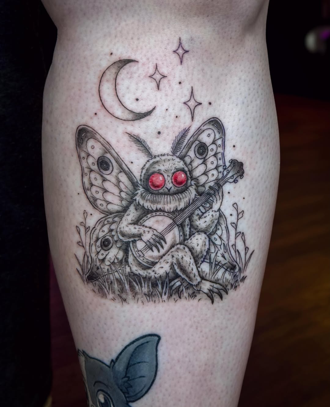 Butterfly creature playing banjo dotwork tattoo on the thigh by Ash✨
