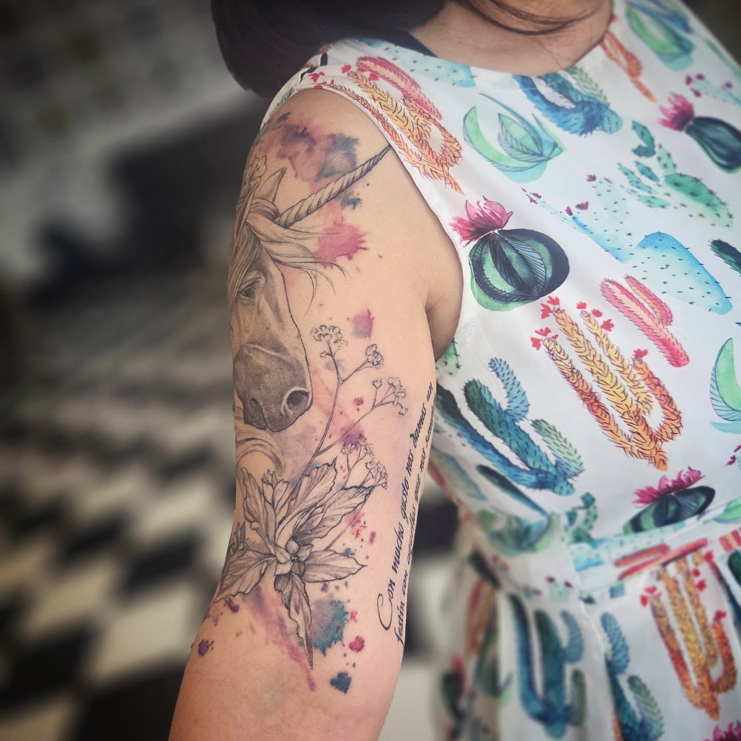 Horse and floral watercolor tattoo on the forearm by Molly DeSmedt