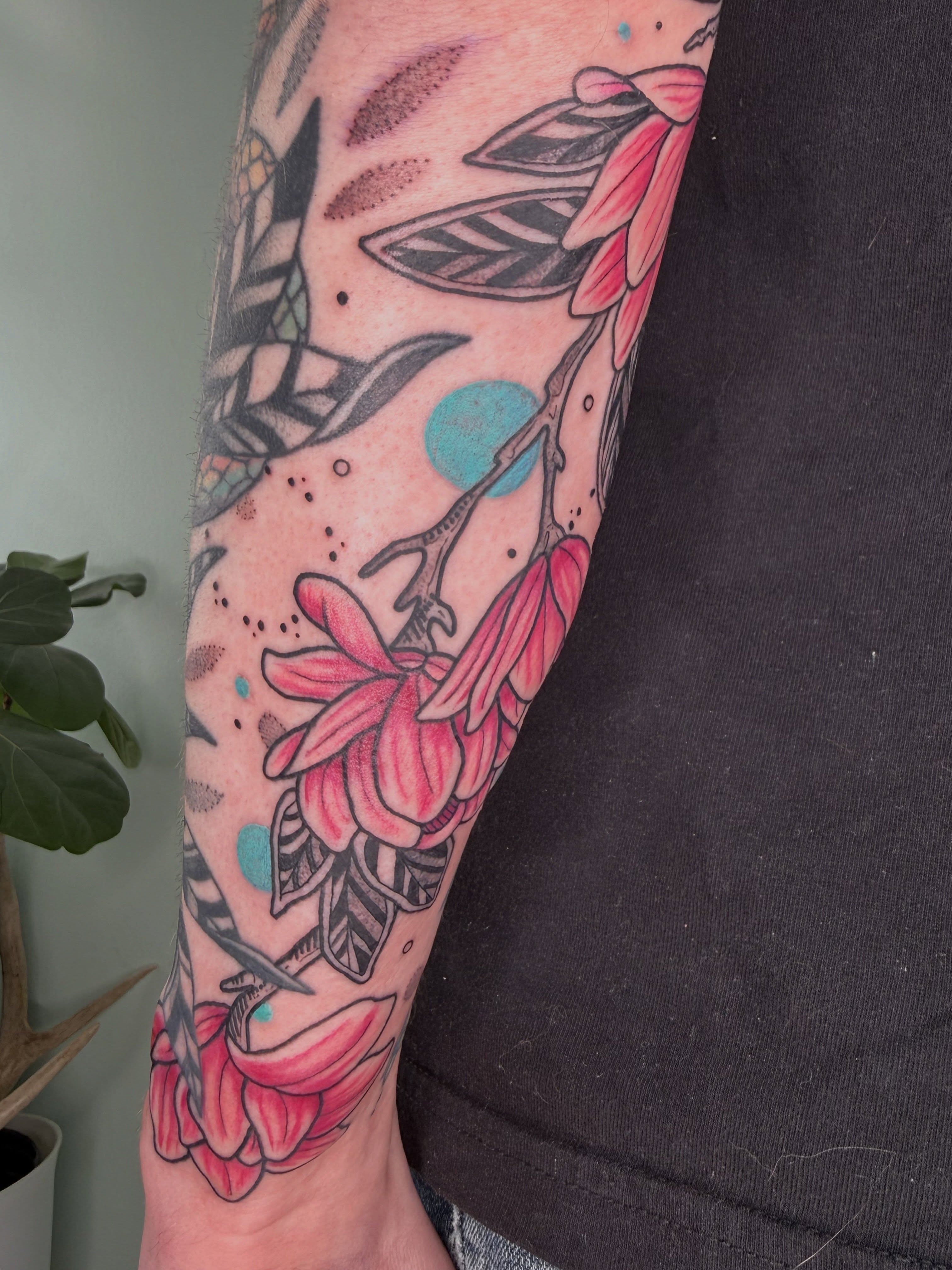 Magnolia flowers dotwork tattoo on the forearm by AJ Jensen