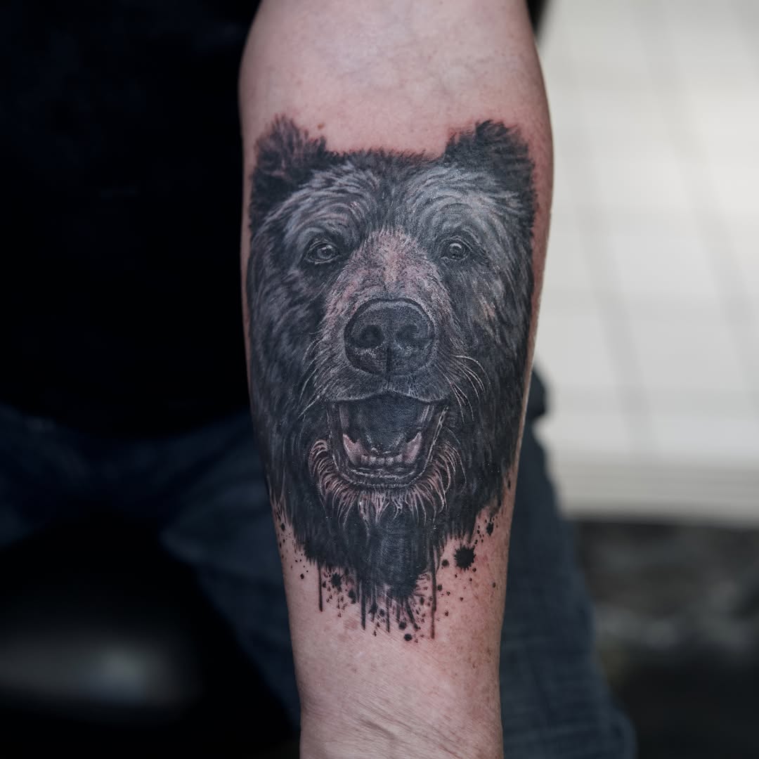 Bear portrait realism tattoo on the forearm by Raven Wood