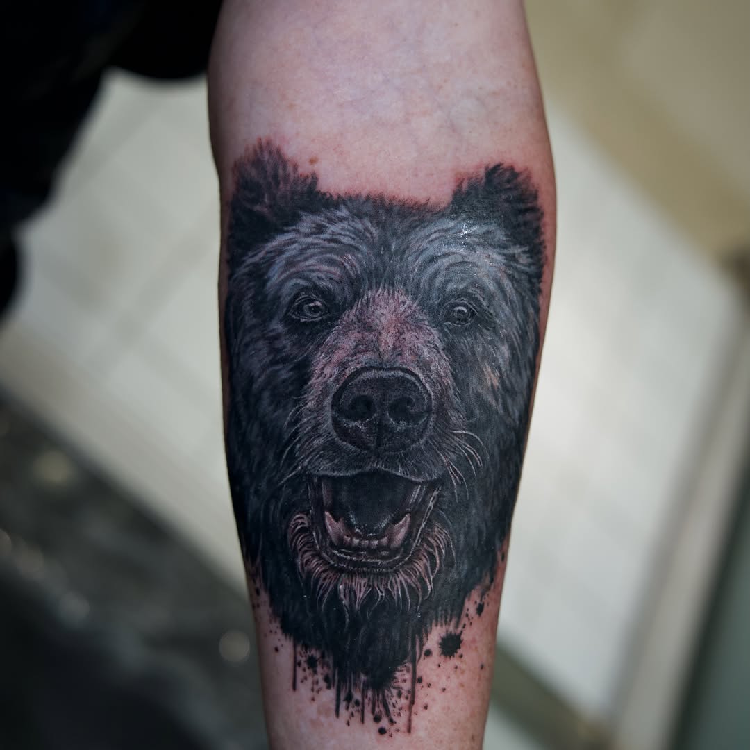 Bear portrait realism tattoo on the forearm by Raven Wood