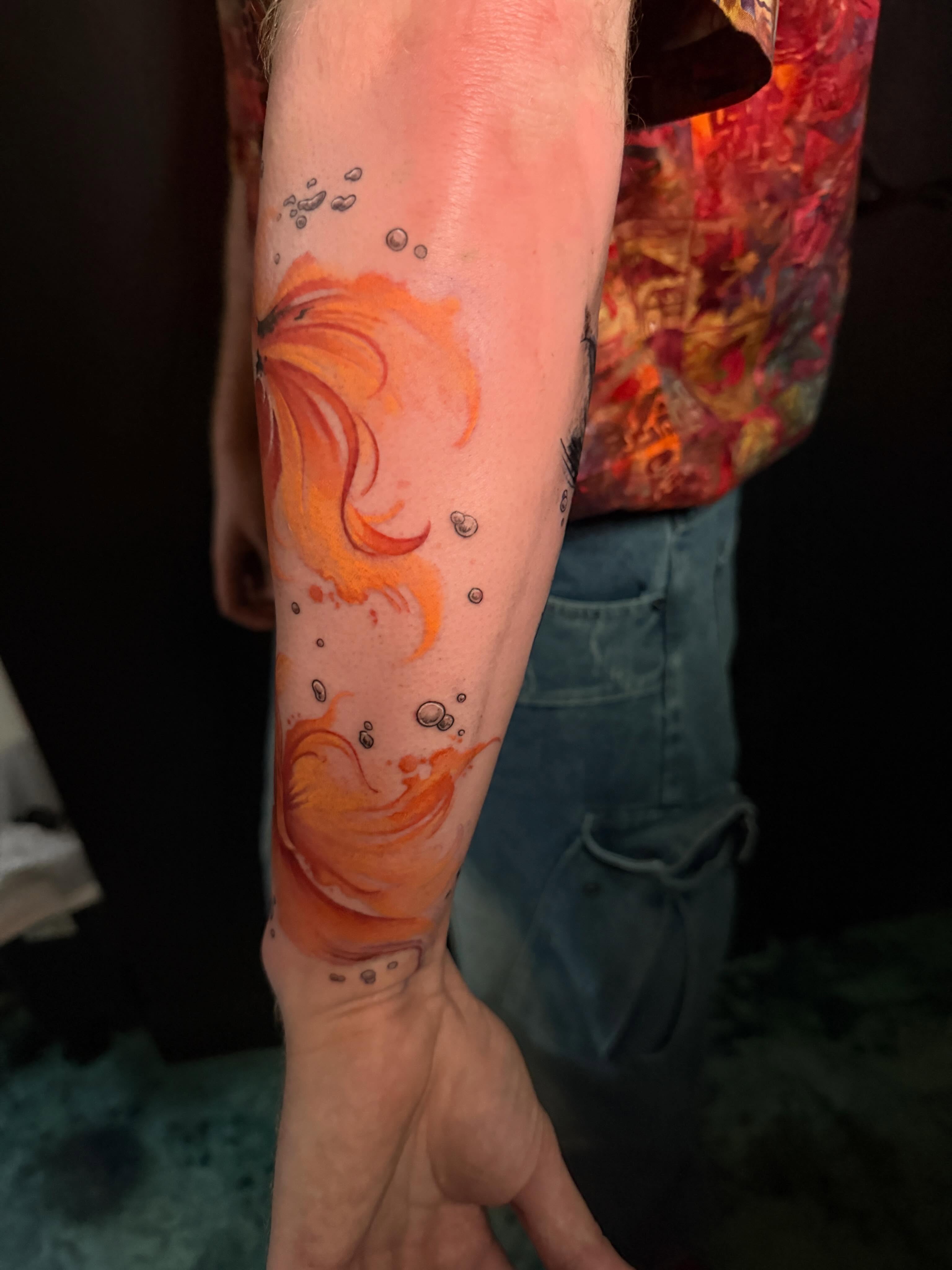 Fire watercolor tattoo on the forearm by Violet Michelle Williams, Charlotte, North Carolina