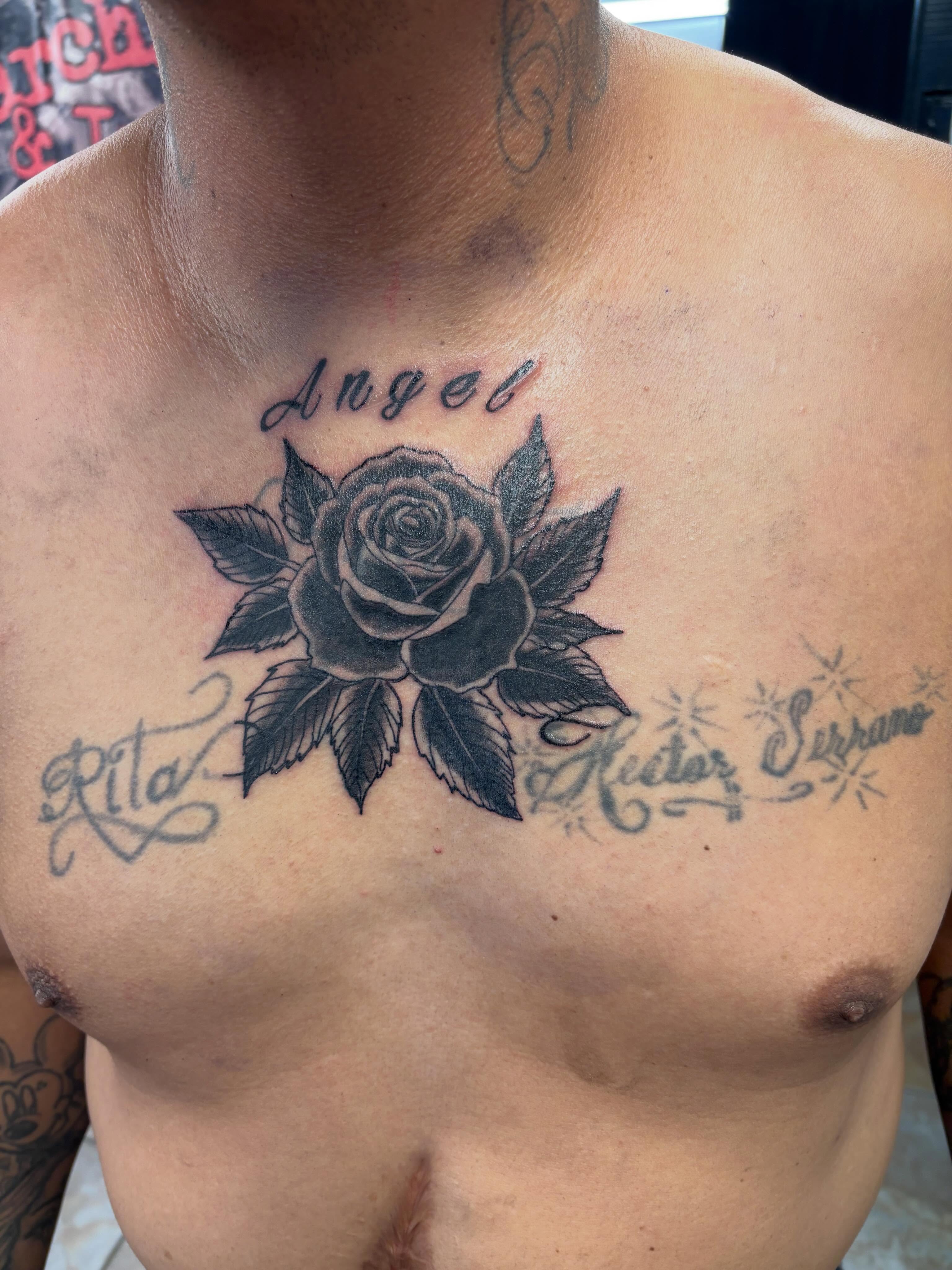 Rose black and grey tattoo on the chest by Stoney