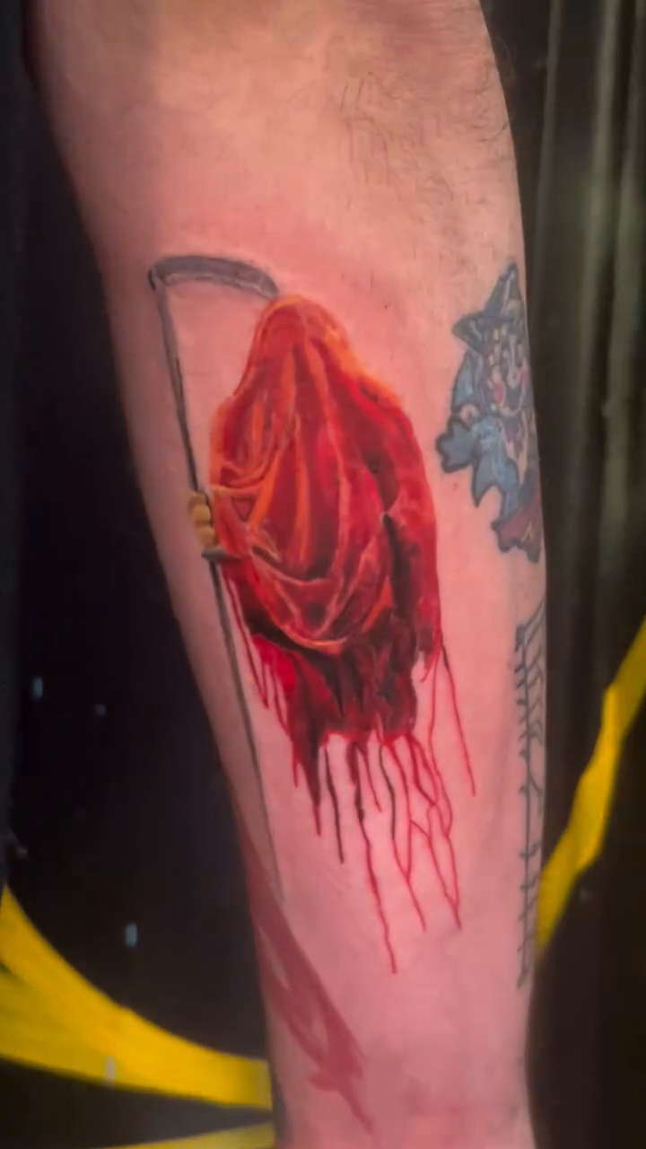 Grim reaper with scythe dark art tattoo on the forearm by Alexander Haber