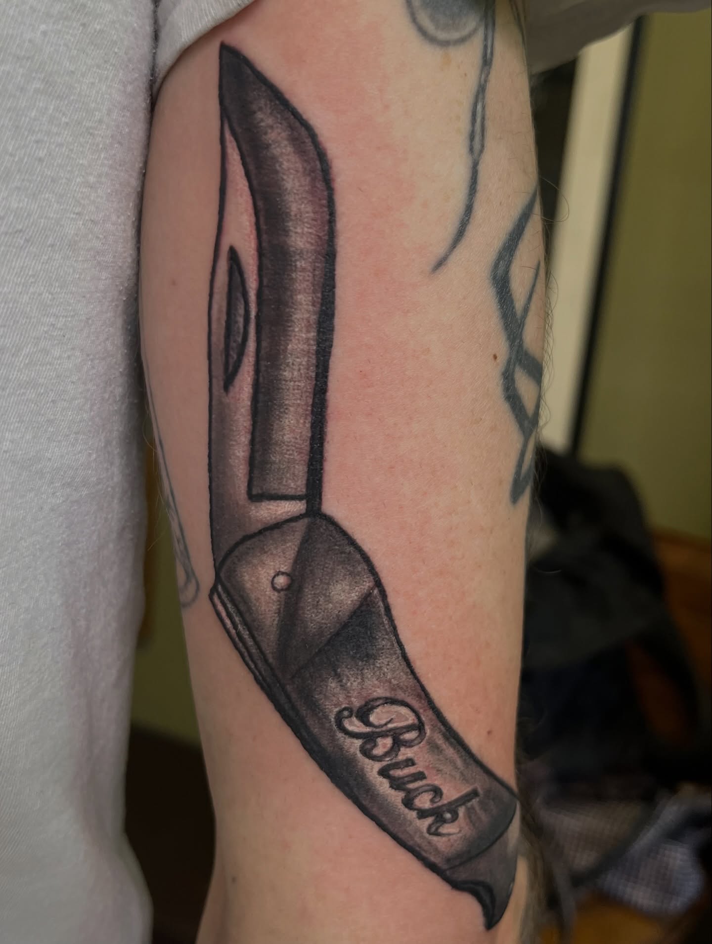 Knife black and grey tattoo on the forearm by Misha Dumois, Seattle, Washington