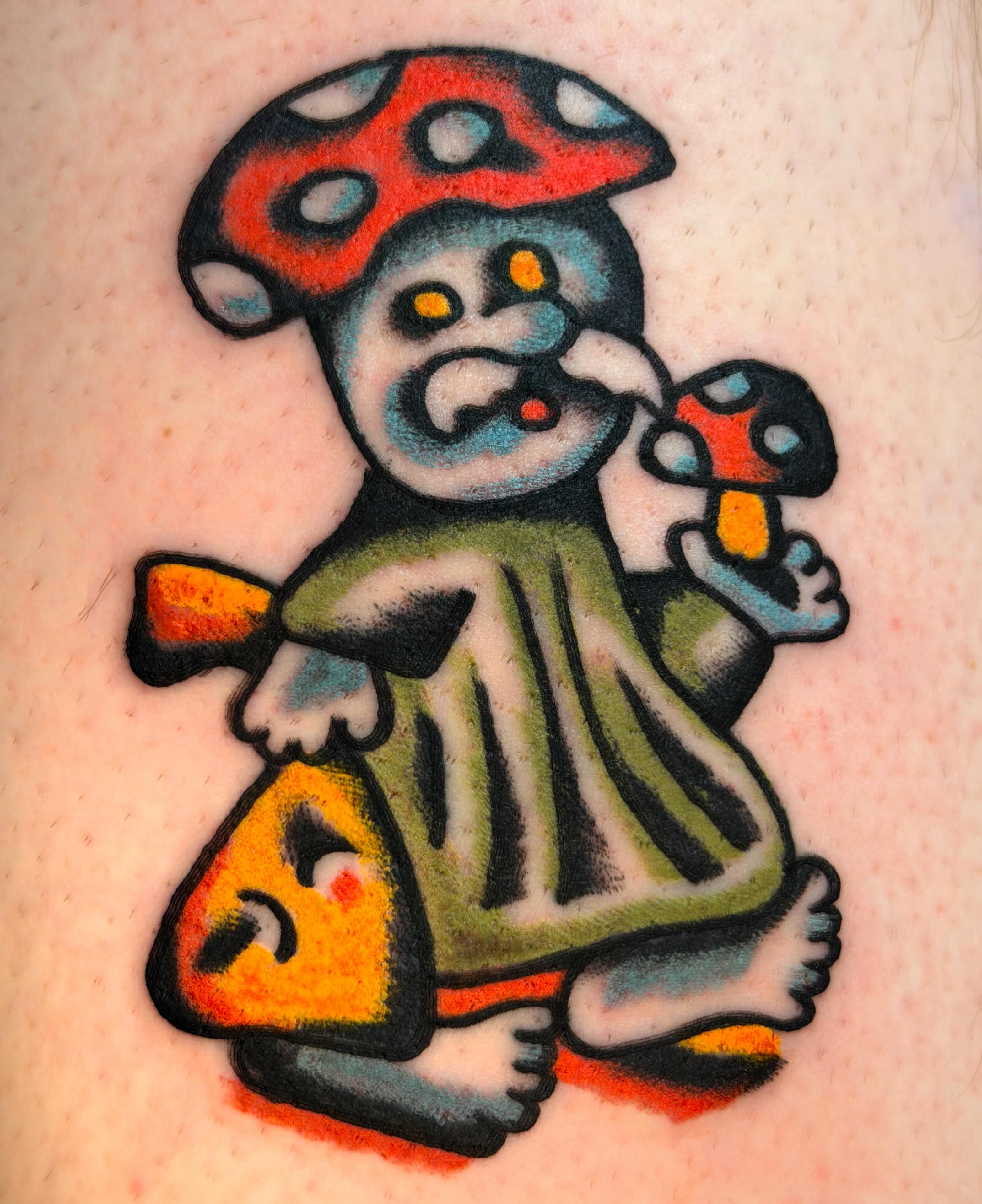 Mushroom character American traditional tattoo on the forearm by Jake