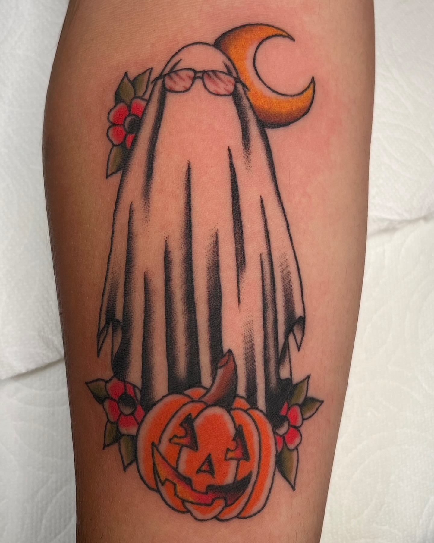 Ghost with sunglasses American traditional tattoo on the forearm by Tiffani Thompson, San Diego, California