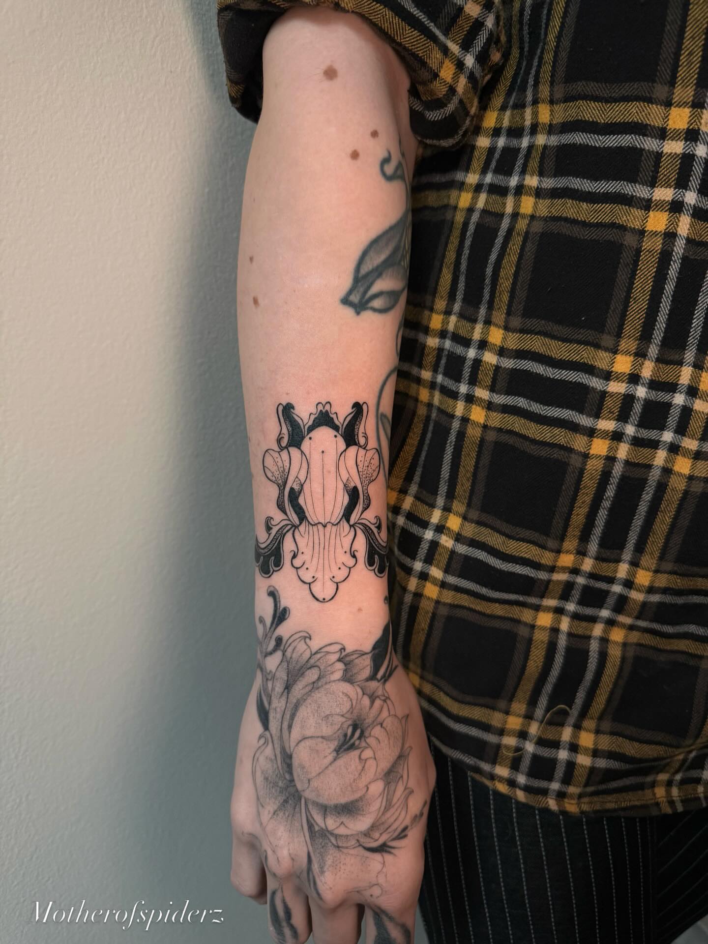 Peony and floral ornament black and grey tattoo on the forearm by Alyssa Garza
