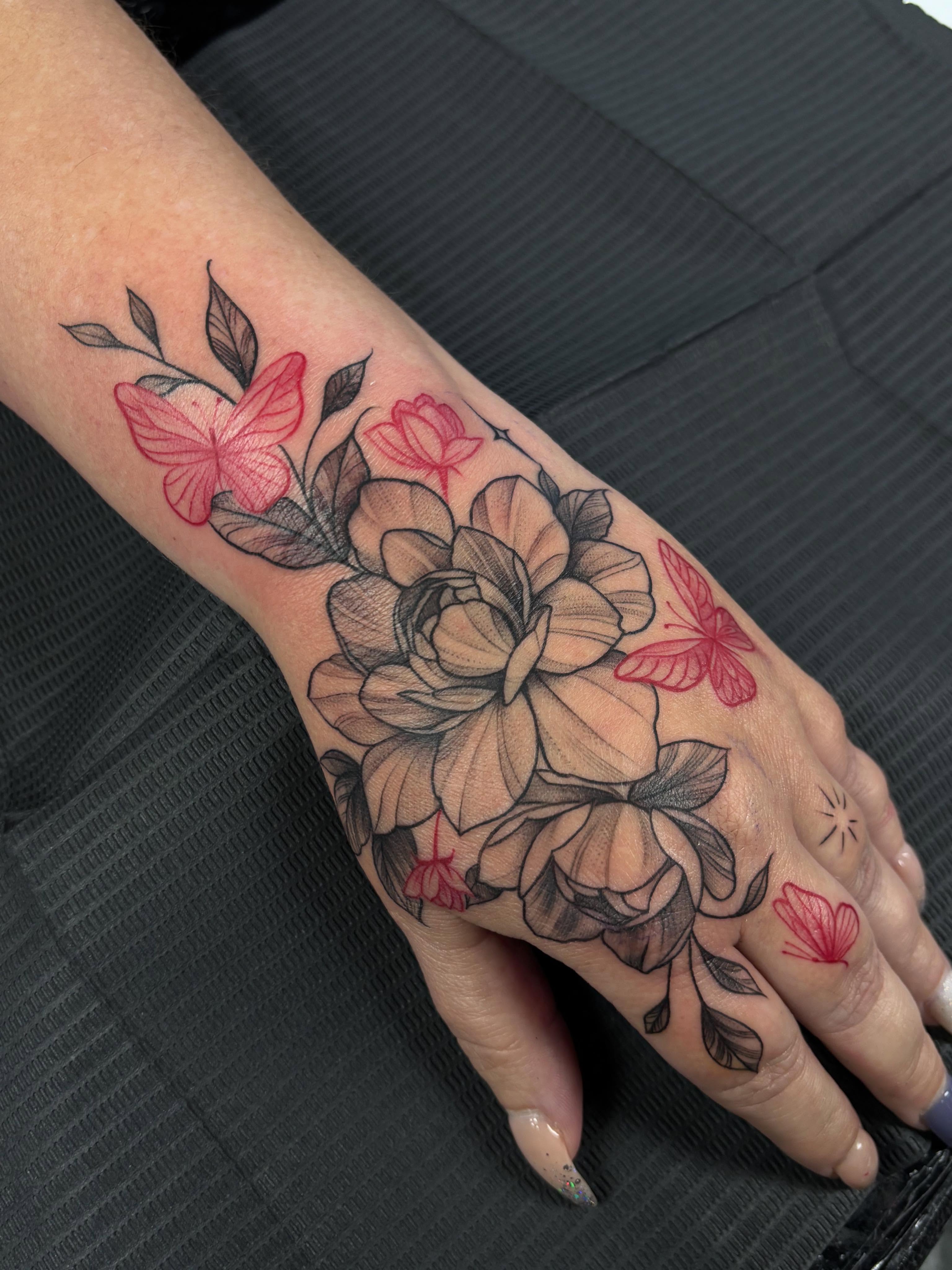 Floral bouquet realism tattoo on the hand by Jennifer Flores