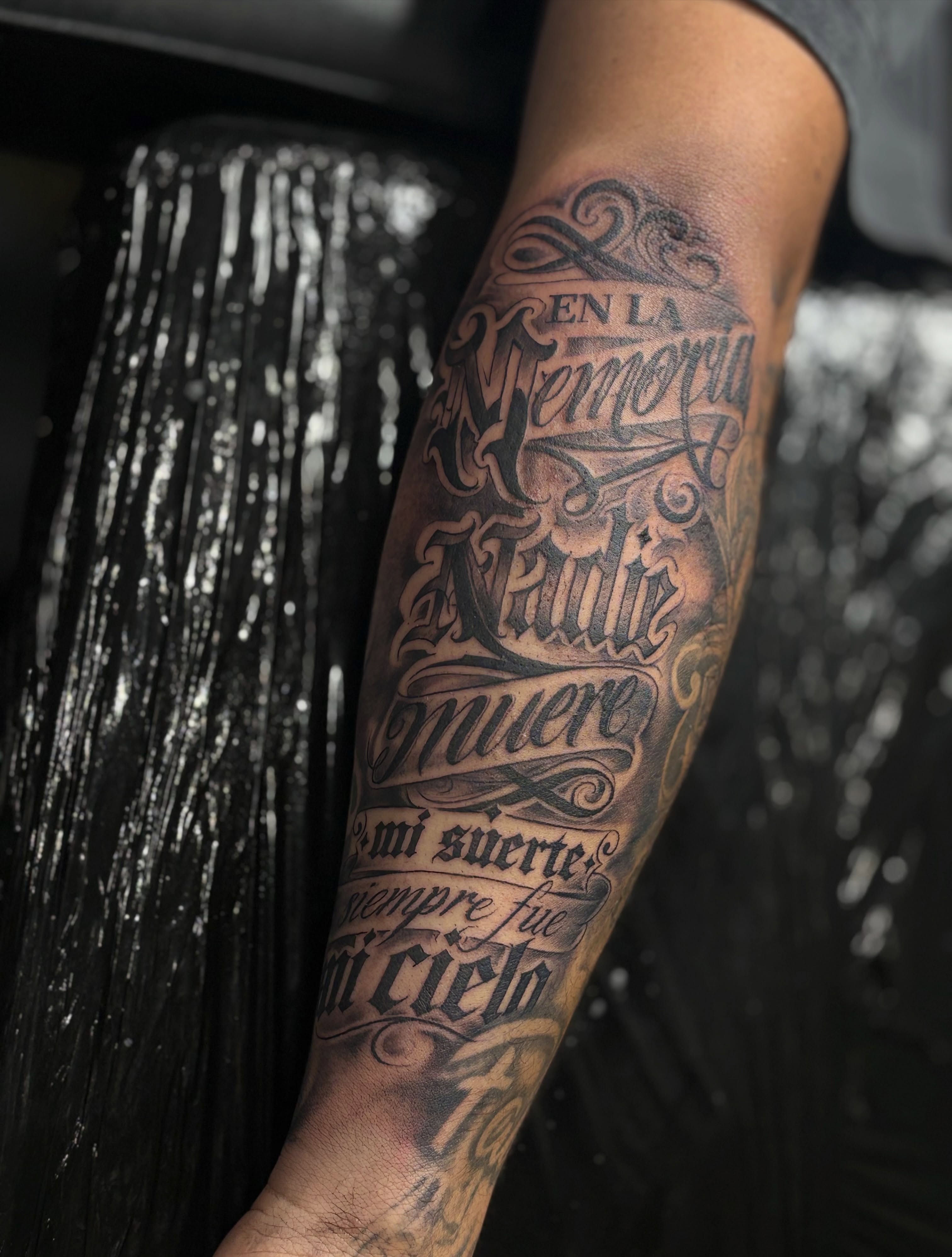 Memorial quote lettering script tattoo on the forearm by Kevin