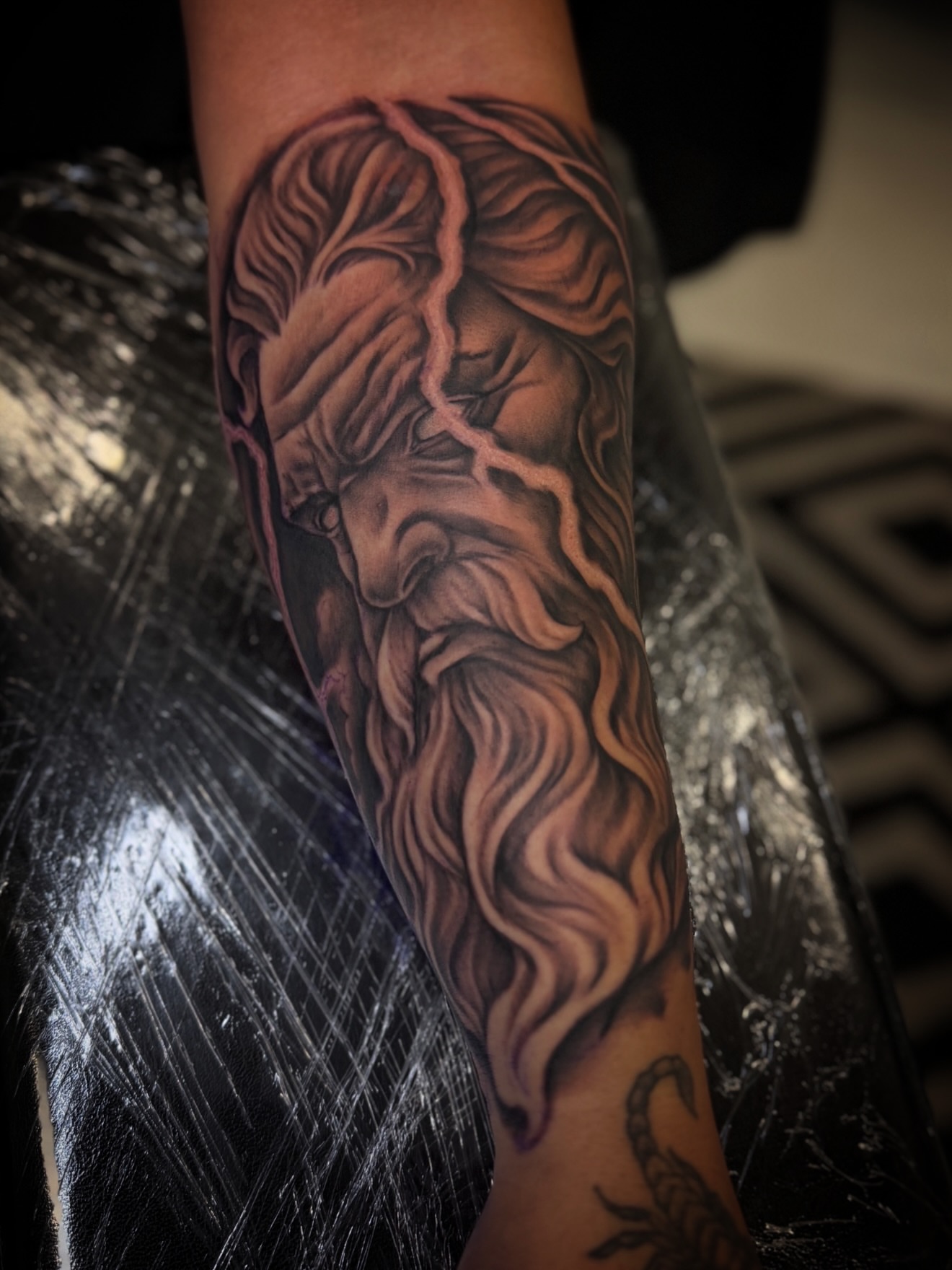 God-like figure realism tattoo on the forearm by Rikky Bobby, Mesa, Arizona