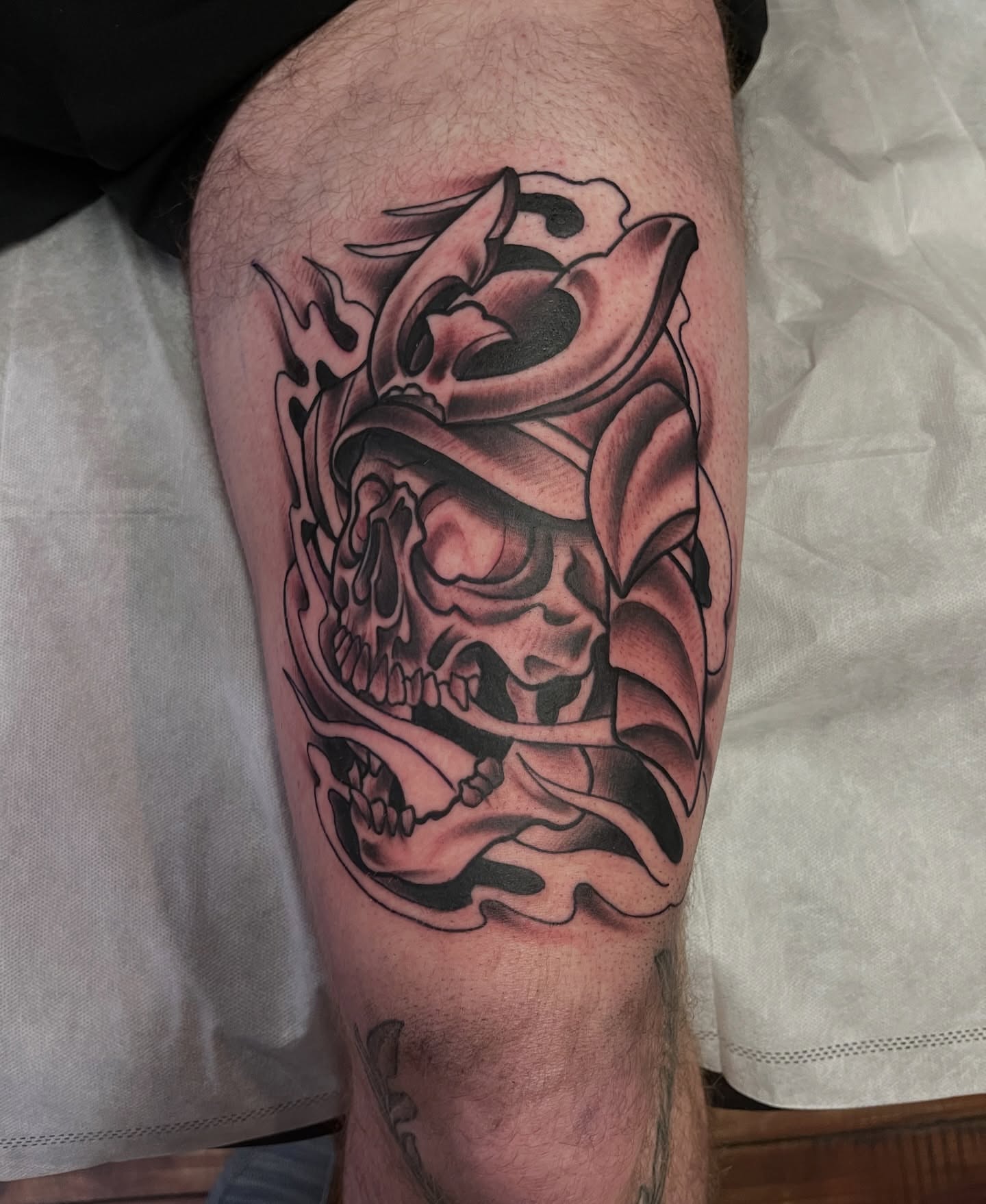 Skull and flames realism tattoo on the thigh by Fizzy Jizzles, Worcester, England