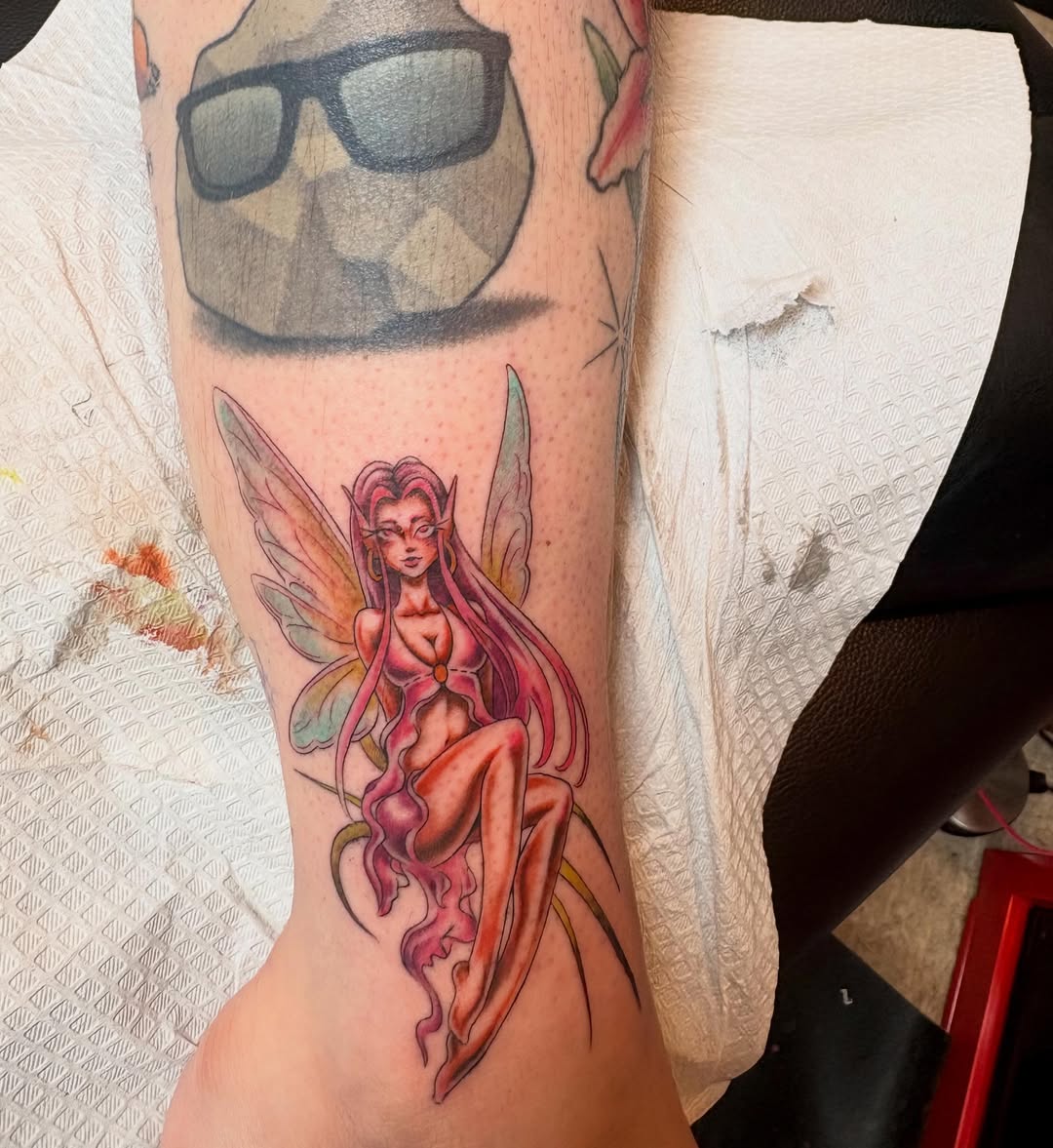 Fairy watercolor tattoo on the forearm by Adriana Wimler