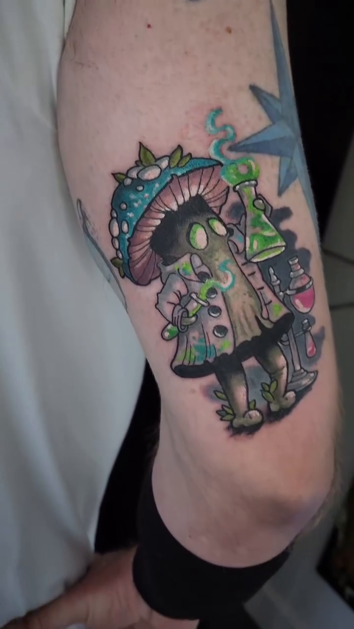 Mushroom alchemist character American traditional tattoo on the forearm by Randy