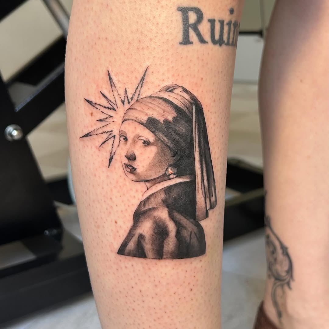 Girl with a Pearl Earring surrealism tattoo on the forearm by kuna ink