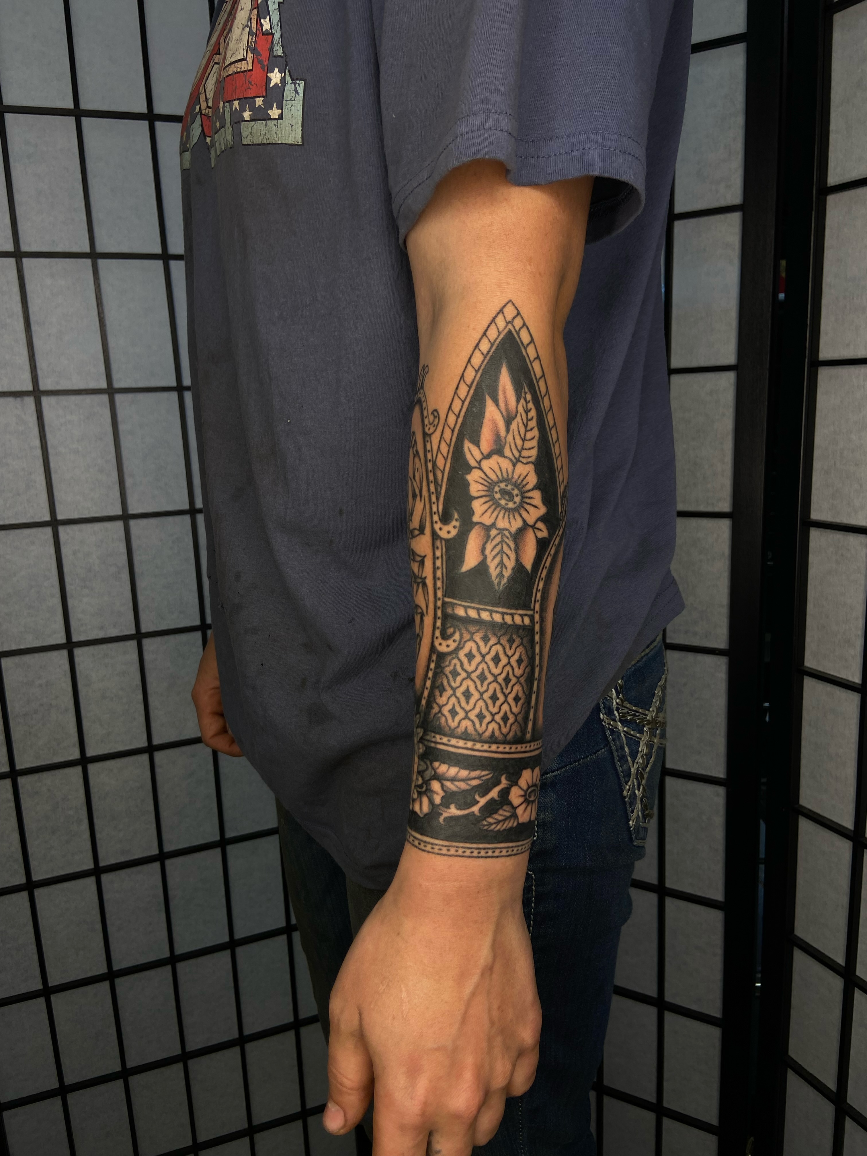 Floral arrangement black and grey tattoo on the forearm by R y a n S m i t h