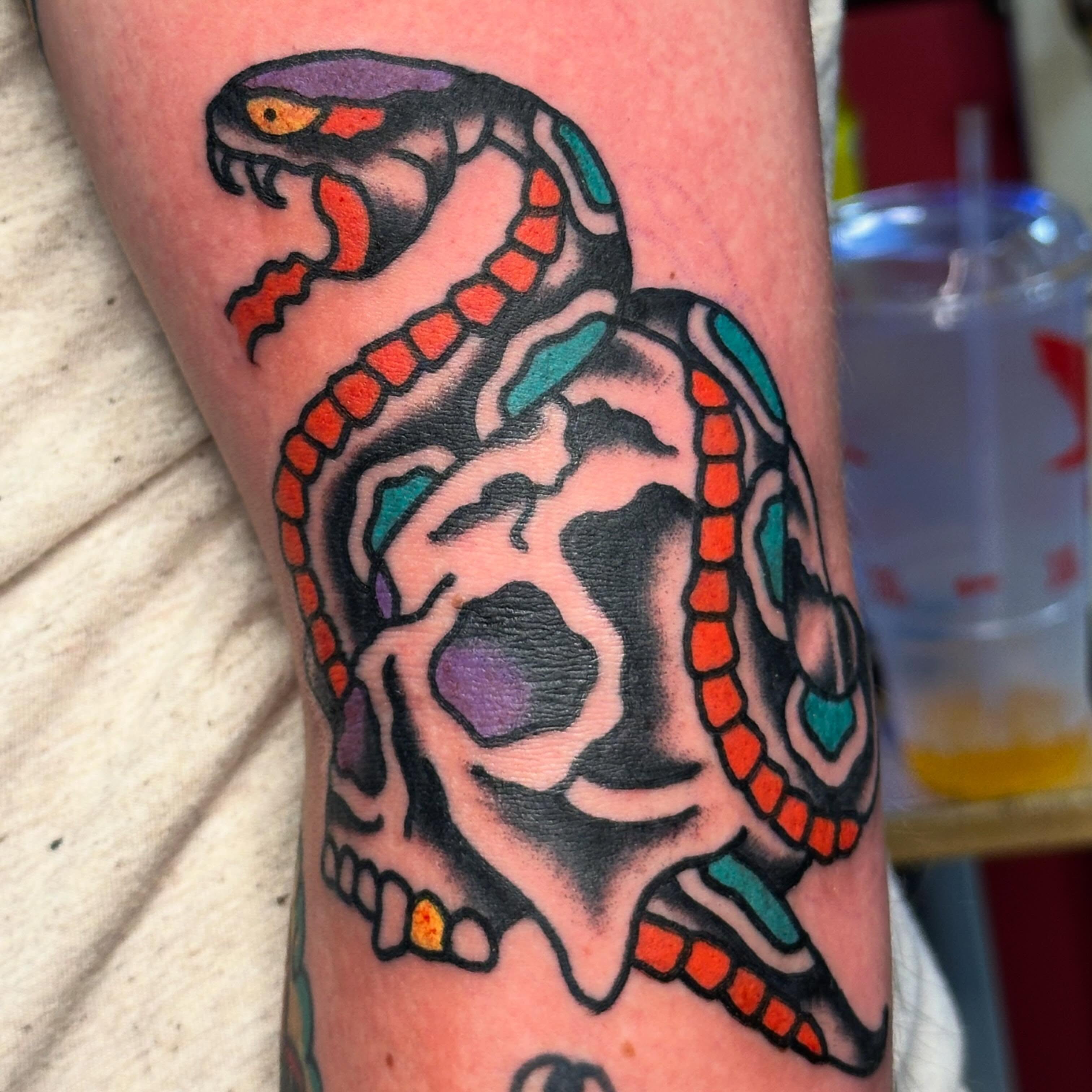 Snake and skull American traditional tattoo on the forearm by Rob, Nashville, Tennessee