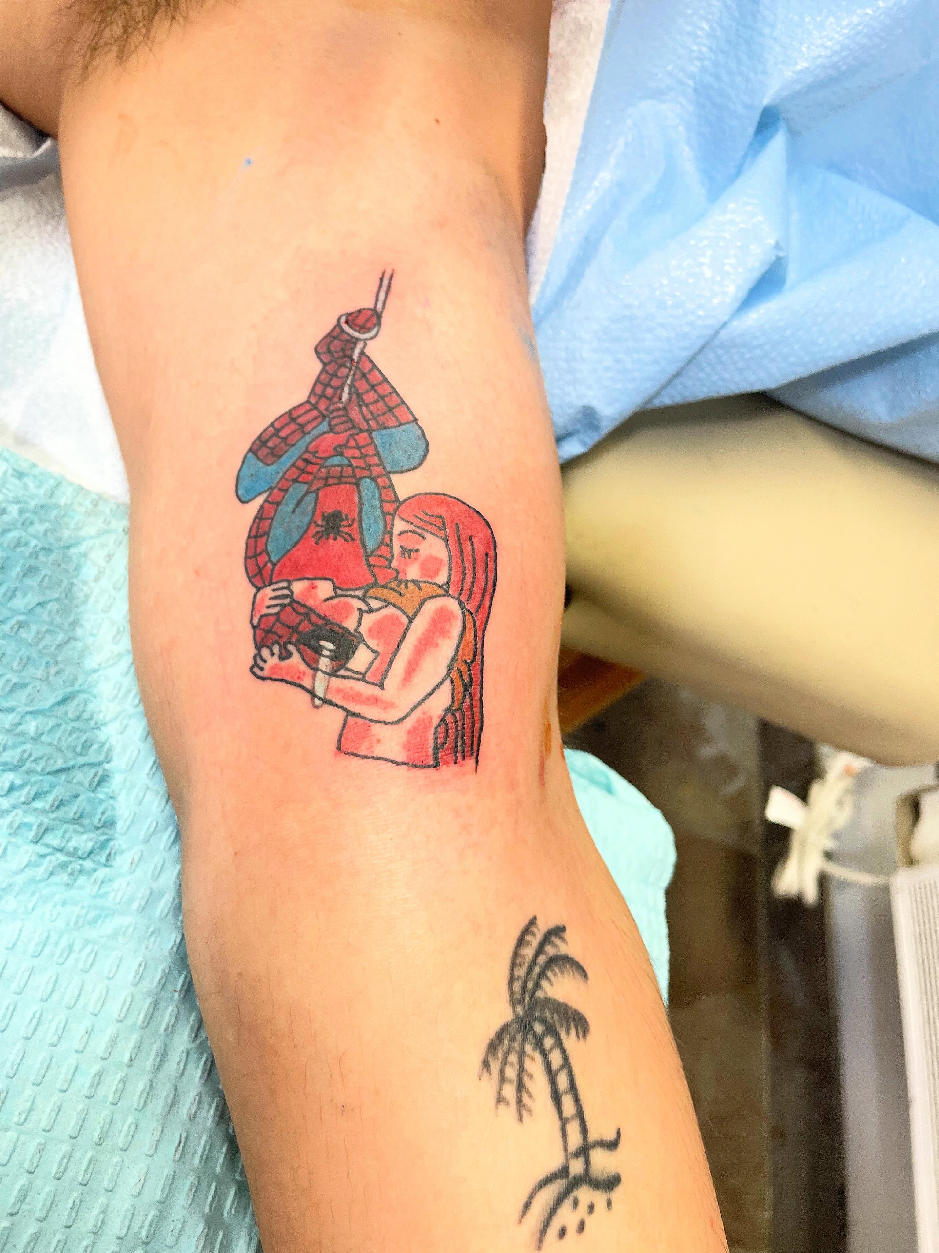 Spiderman and woman dotwork tattoo on the forearm by Stoney