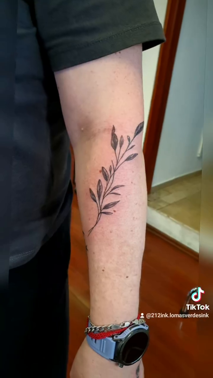 Constellation and sprig fine line tattoo on the forearm by Tatuajes Betto Ink Tattoo