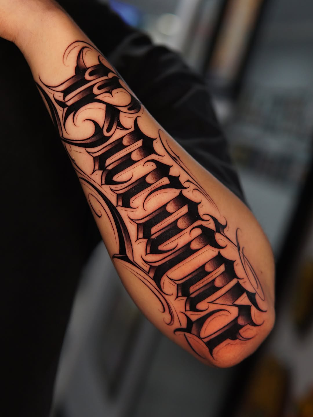 Script lettering Chicano tattoo on the forearm by Atlanta Tattoo Artist, Atlanta, Georgia