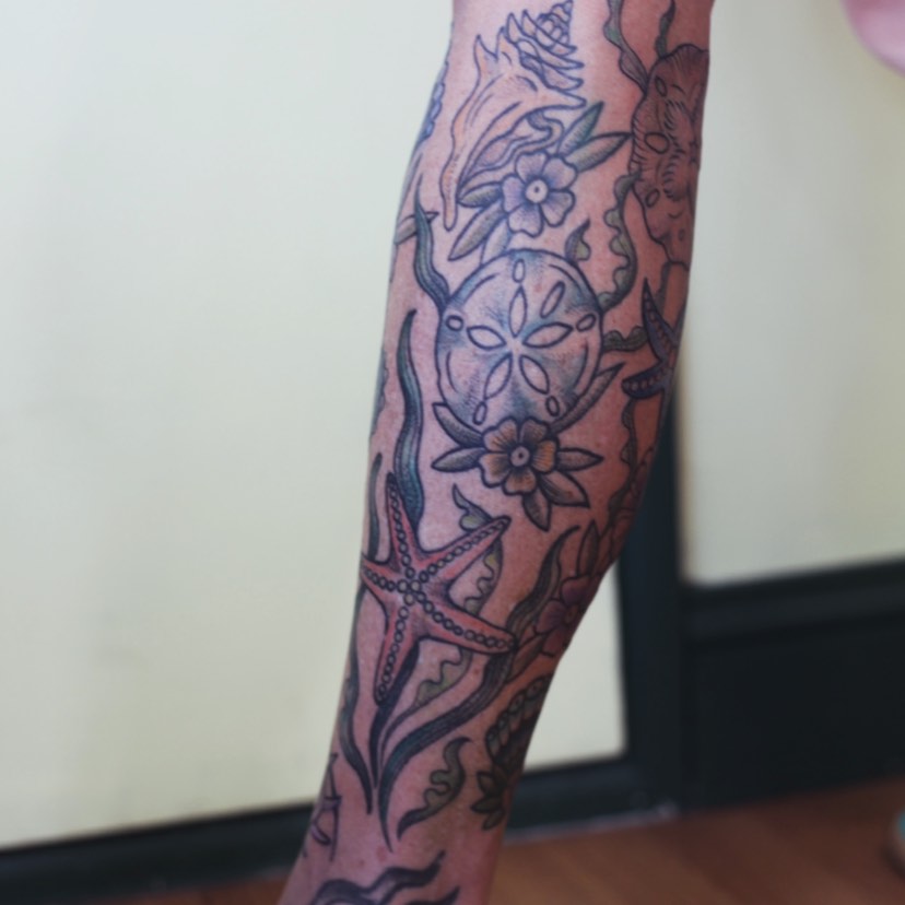 Seashell and floral American traditional tattoo on the forearm by adrienne mae ❀