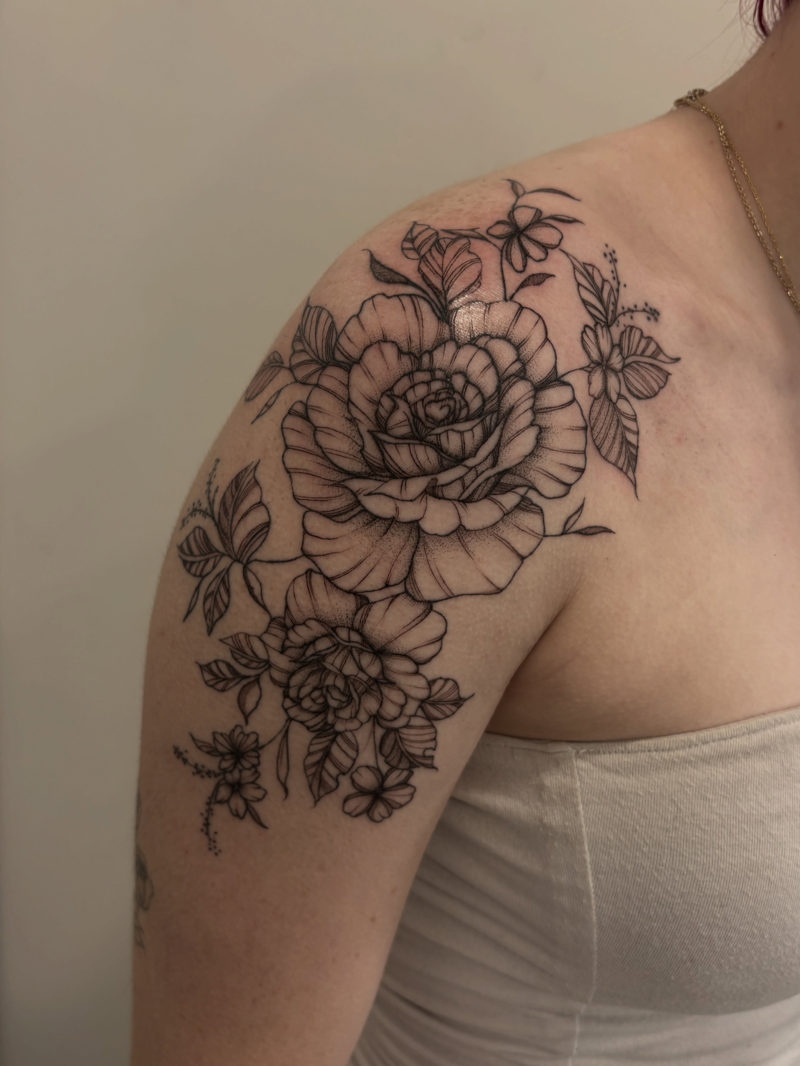 Floral bouquet realism tattoo on the shoulder by Tayler, Tooele, Utah