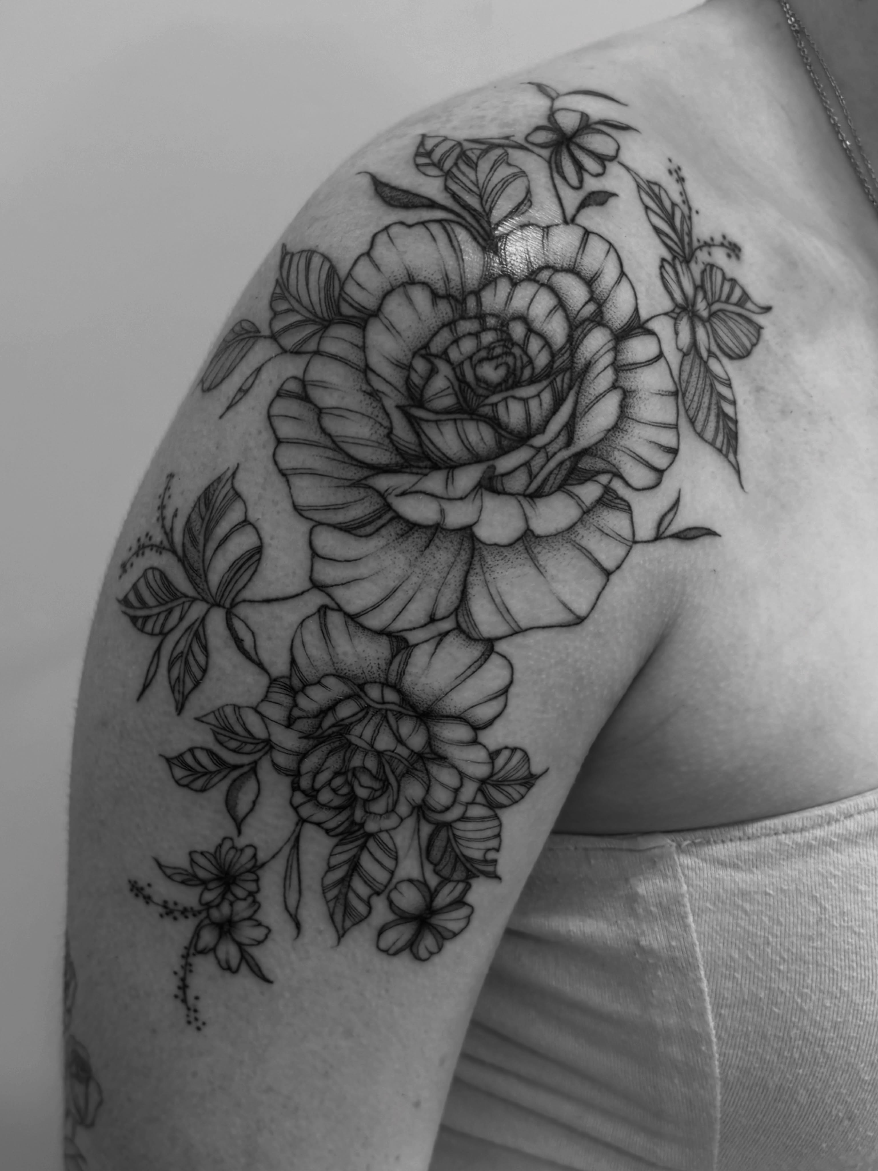 Floral bouquet realism tattoo on the shoulder by Tayler, Tooele, Utah