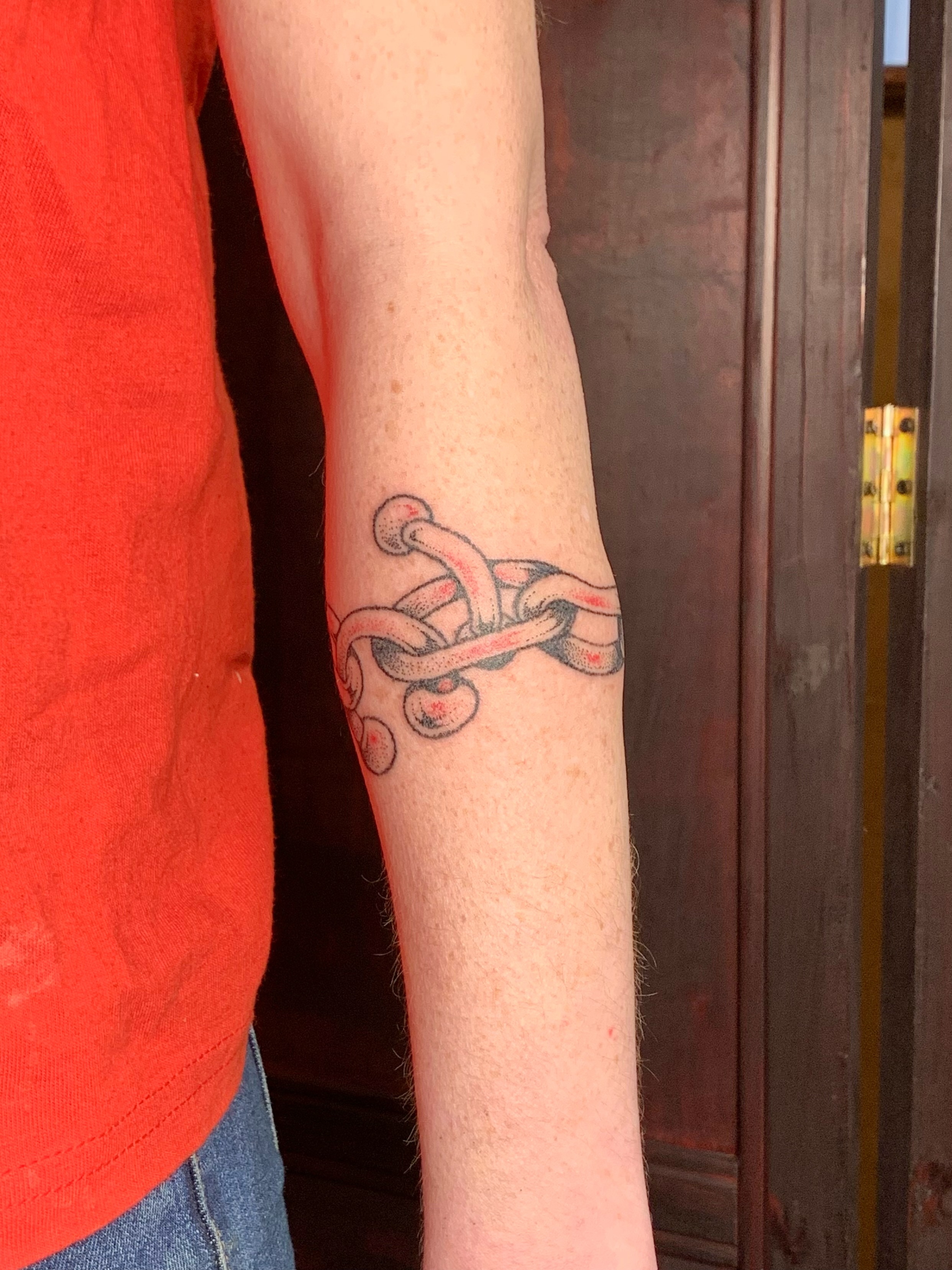Octopus tentacles dotwork tattoo on the forearm by Lex Lloyd
