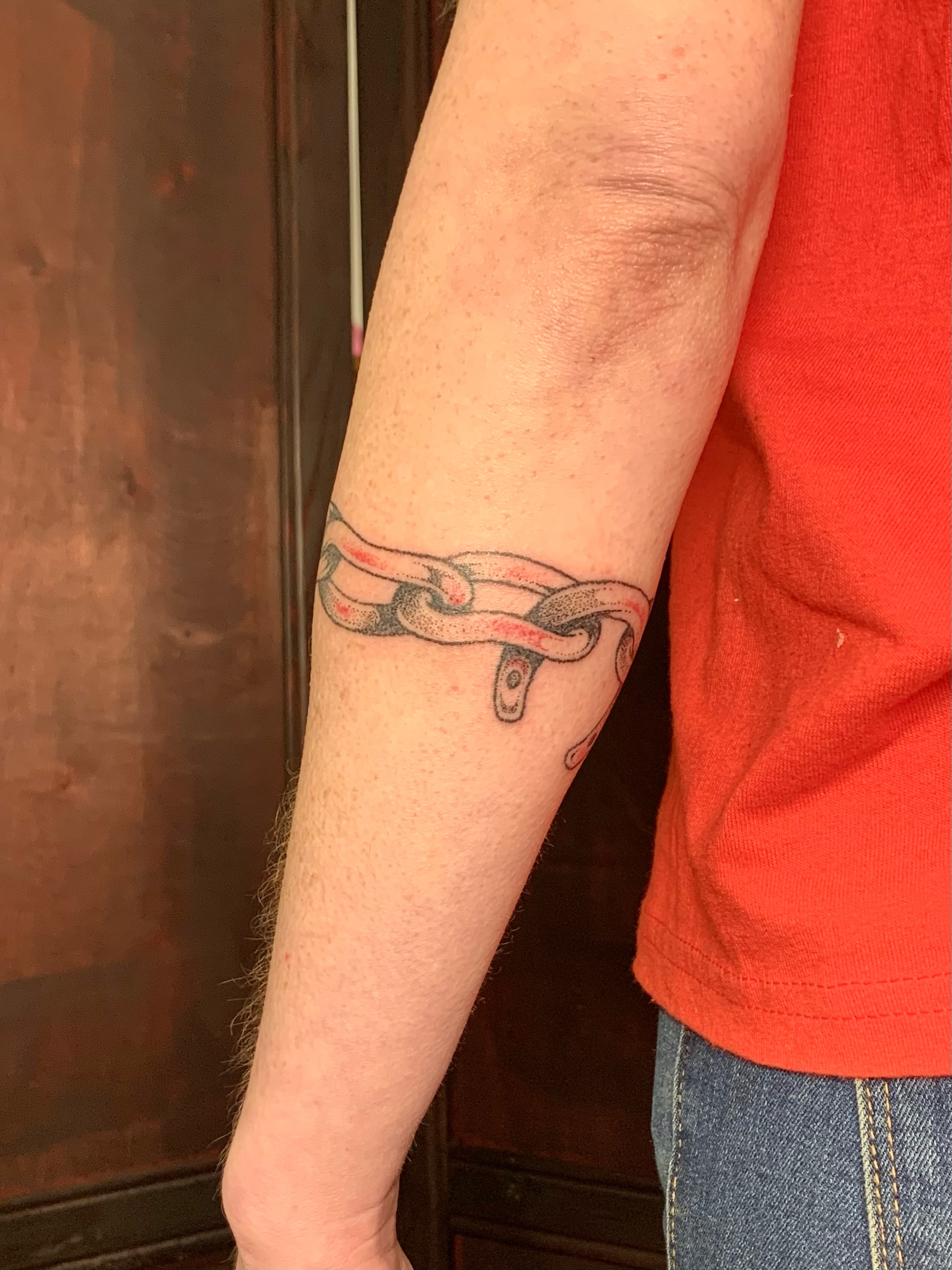 Chain black and grey tattoo on the forearm by Lex Lloyd