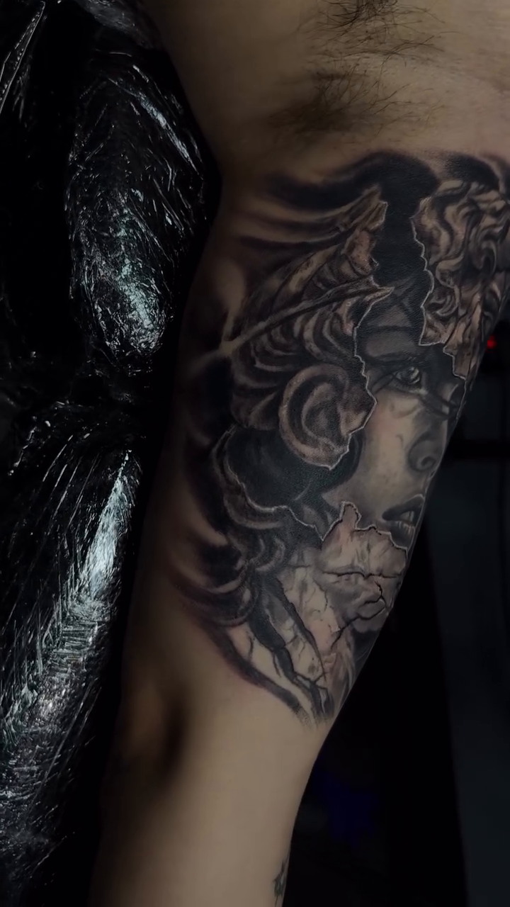 Medusa tattoo on arm surrealism tattoo on the upper arm by Tony Hernandez, Chicago, Illinois