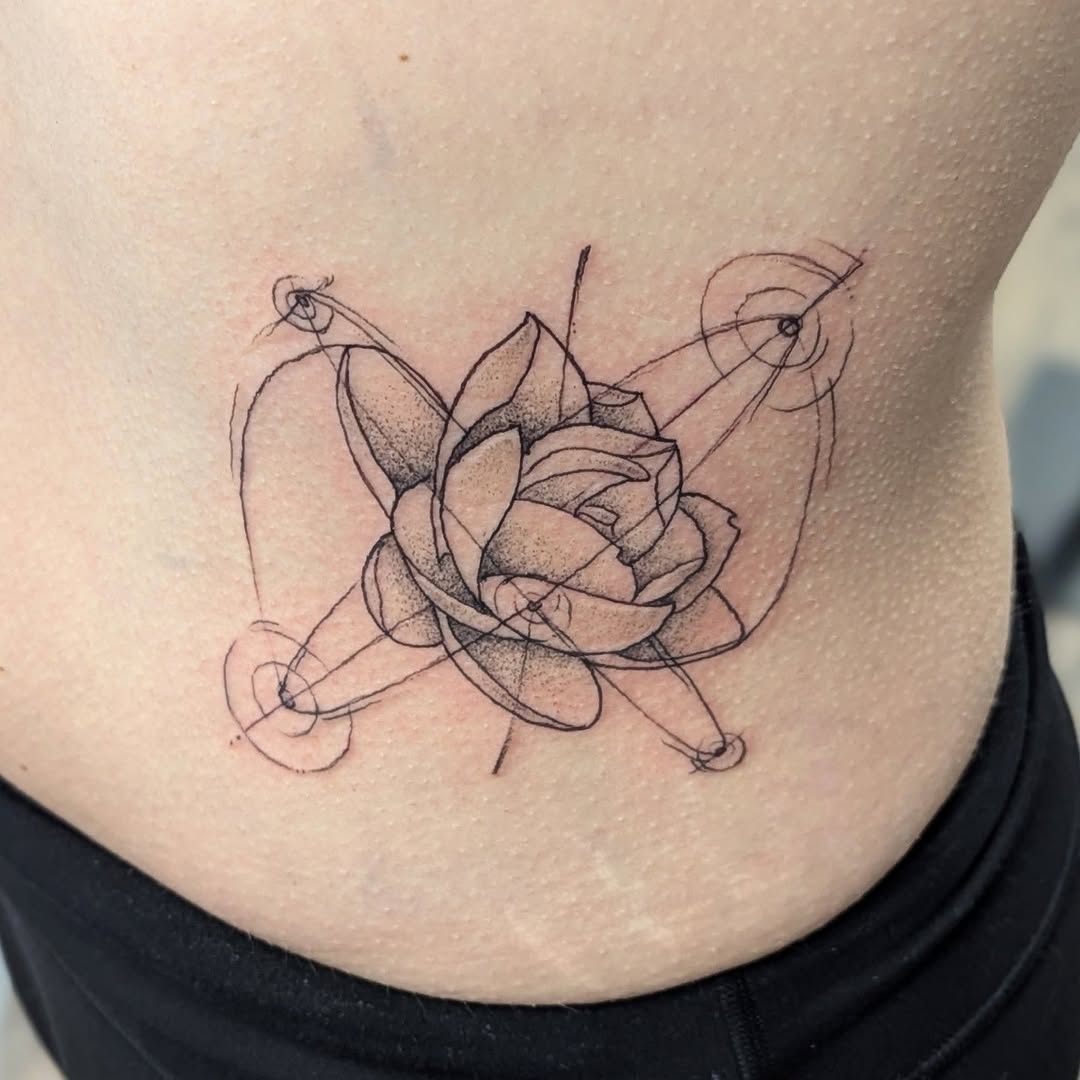Geometric lotus flower sketch tattoo on the ribs by DONEL 📍Denver