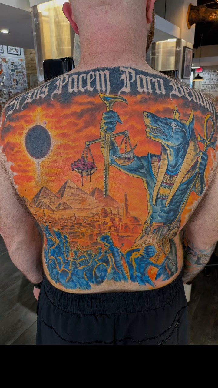 Anubis with sword and Egyptian landscape tattoo on the back by Nic Skrade, Minneapolis, Minnesota