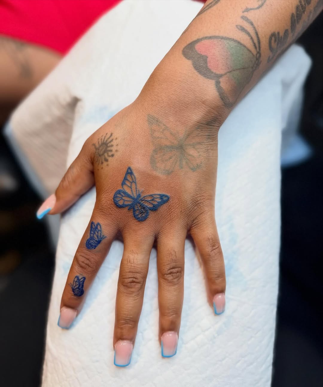 Butterflies fine line tattoo on the hand by Alesia
