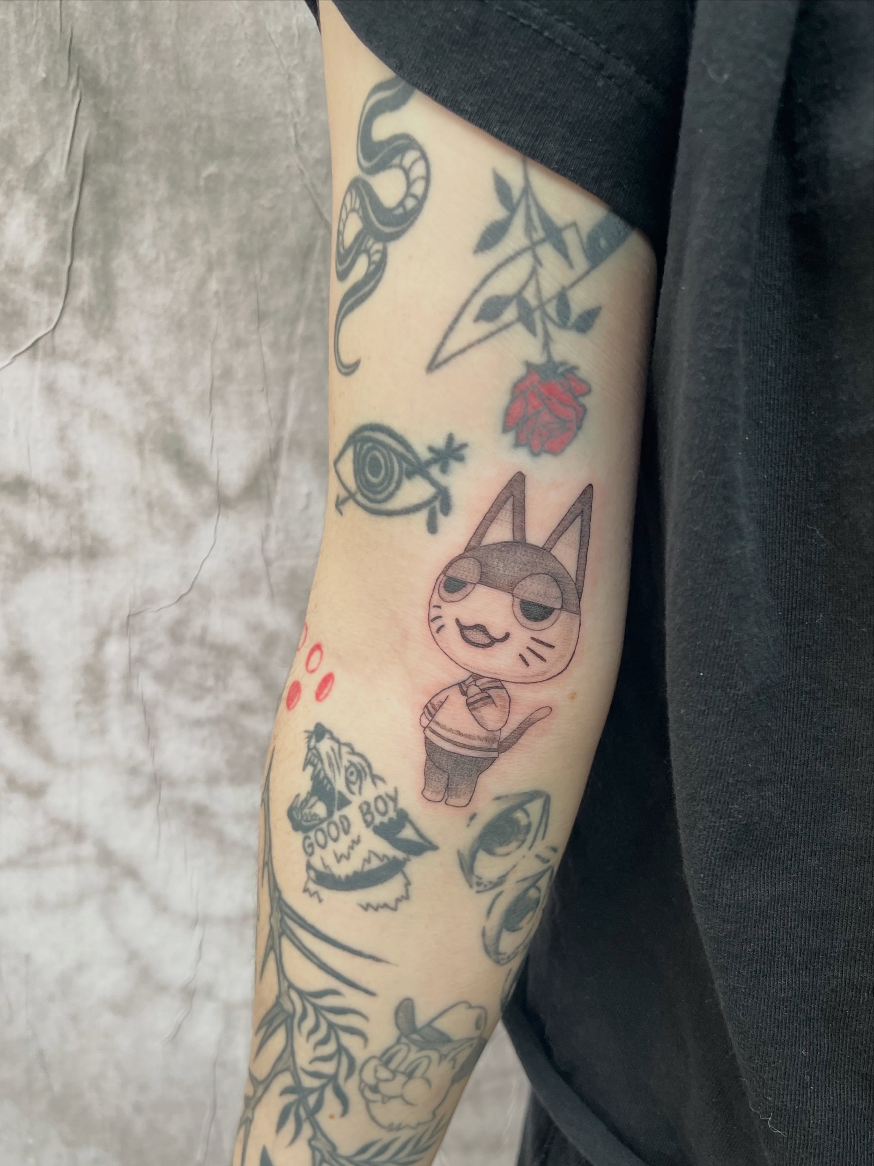 Cat with sunglasses anime tattoo on the forearm by Kyra Monterrosa