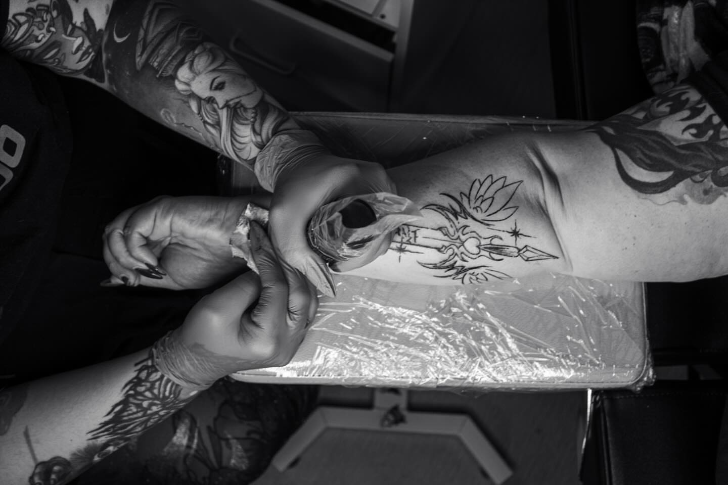 Floral design black and grey tattoo on the forearm by Kerry Rose