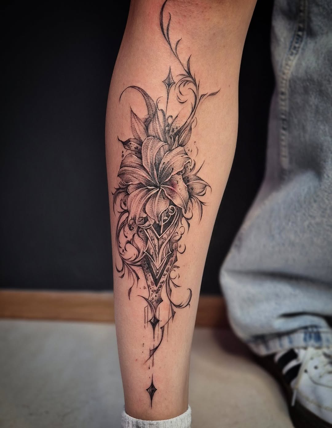 Lily and ornamental shield fine line tattoo on the forearm by Тату Херсон _ Kherson tattoo, Kherson