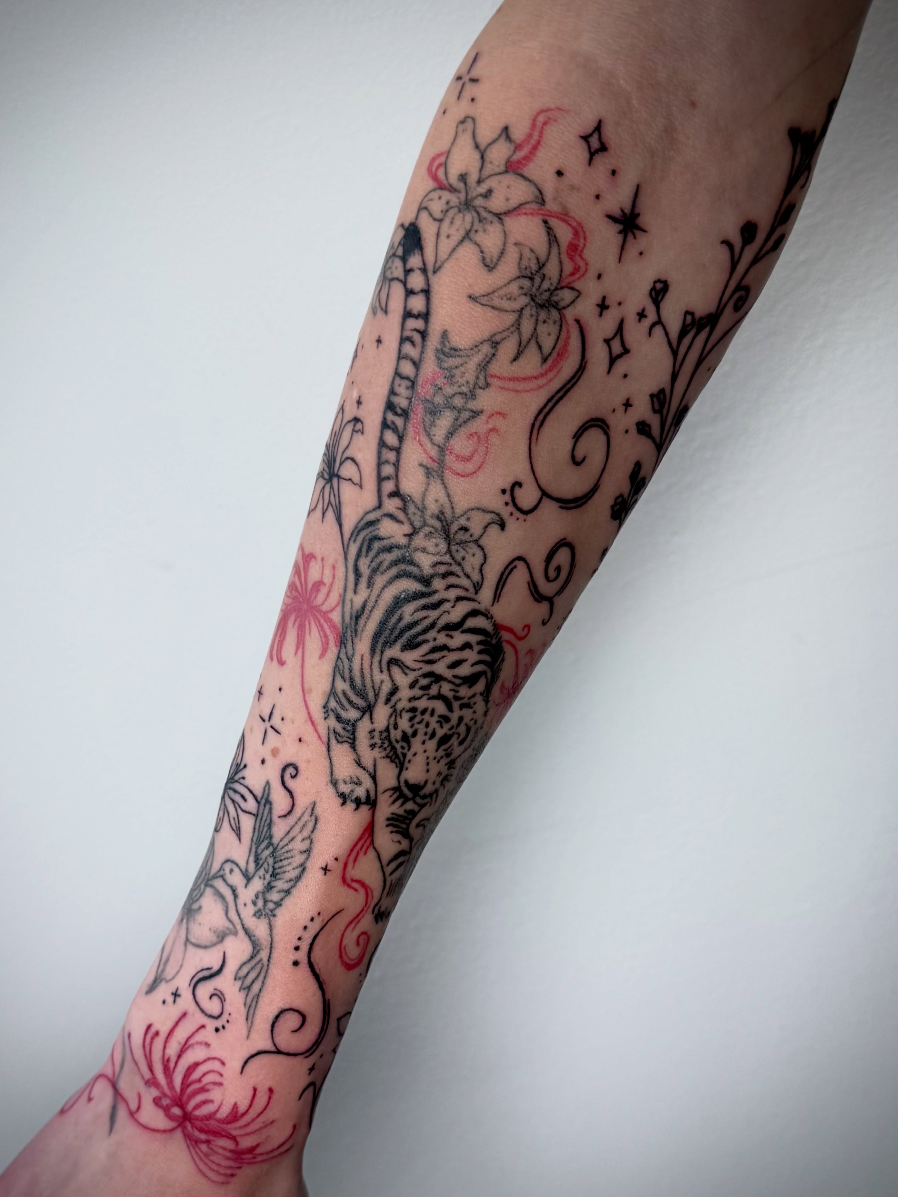 Tiger and flowers American traditional tattoo on the forearm by dev