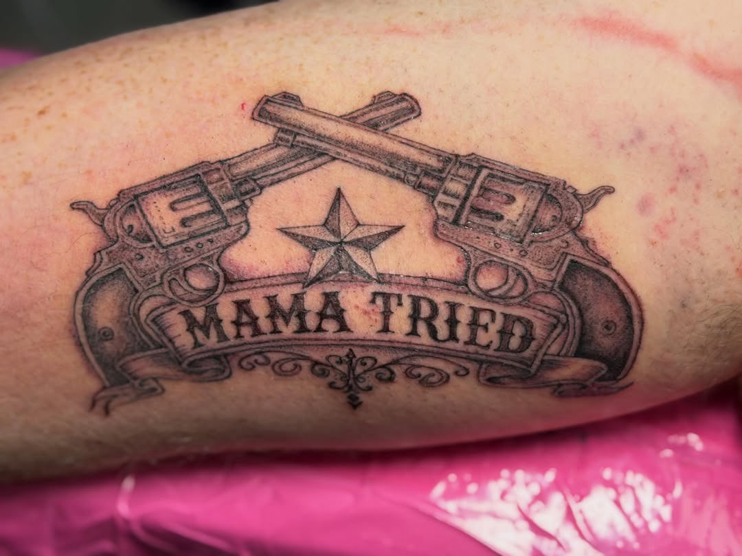 Crossed revolvers with banner and star tattoo on the forearm by Van Cleave Aesthetics, Franklin, Tennessee