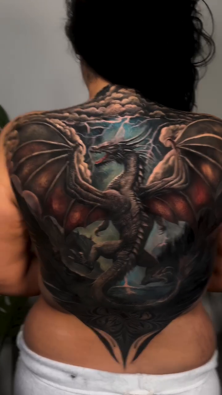 Dragon realism tattoo on the back by ✨ Tattoo Artist