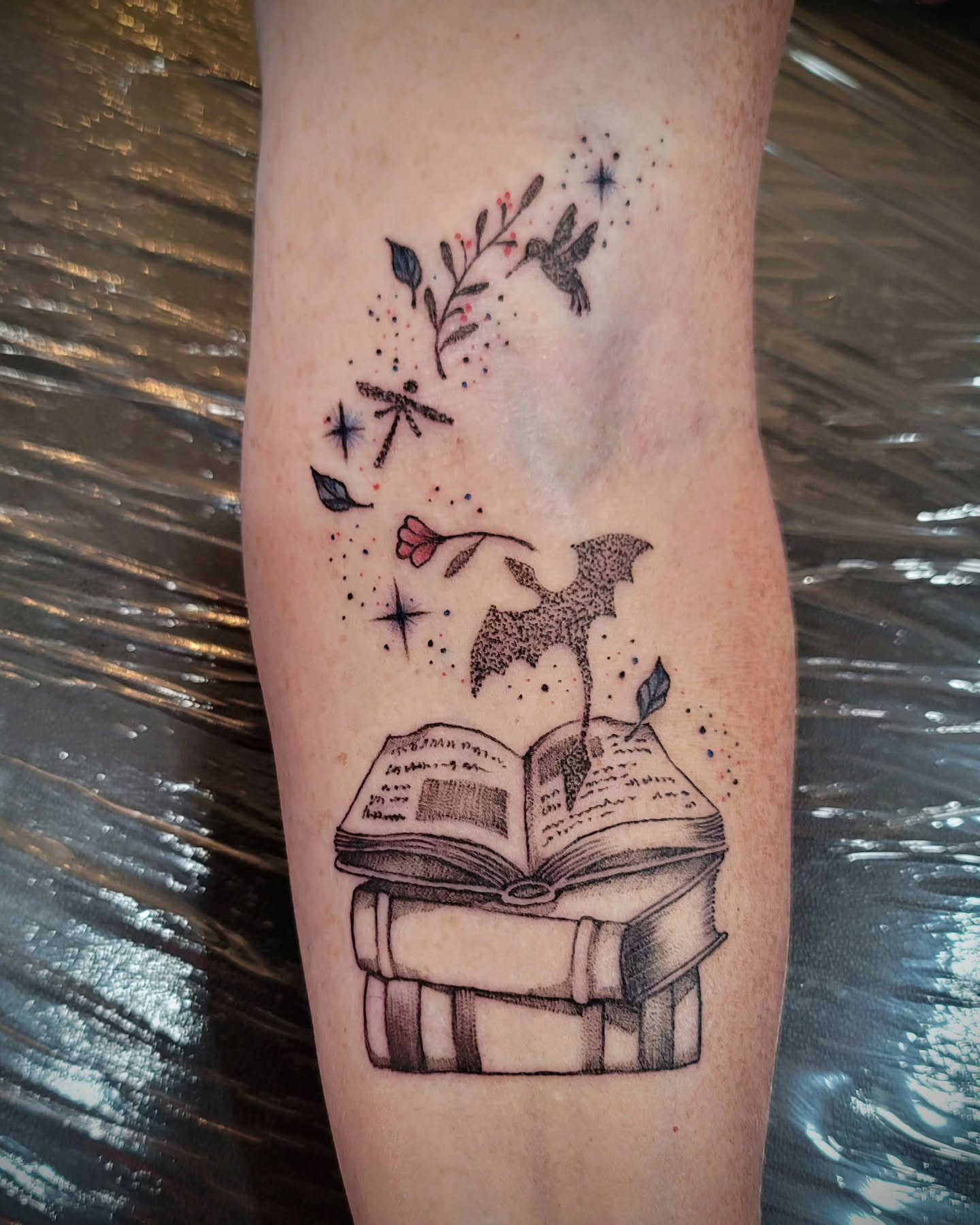 Book and hummingbird dotwork tattoo on the forearm by Tricky Lake, Newfield, New Jersey