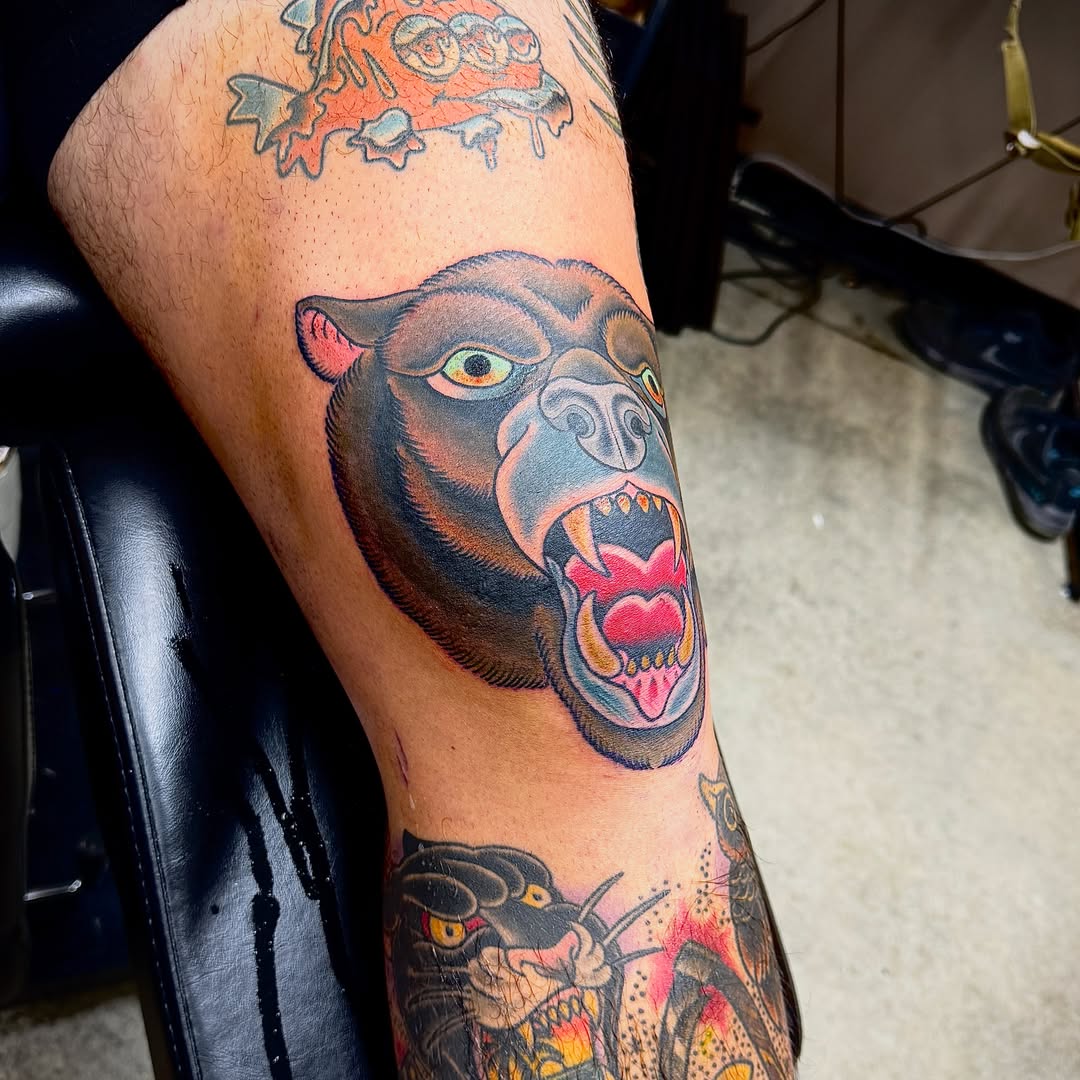 Angry bear American traditional tattoo on the thigh by Derek Cilla, Bethlehem, Pennsylvania