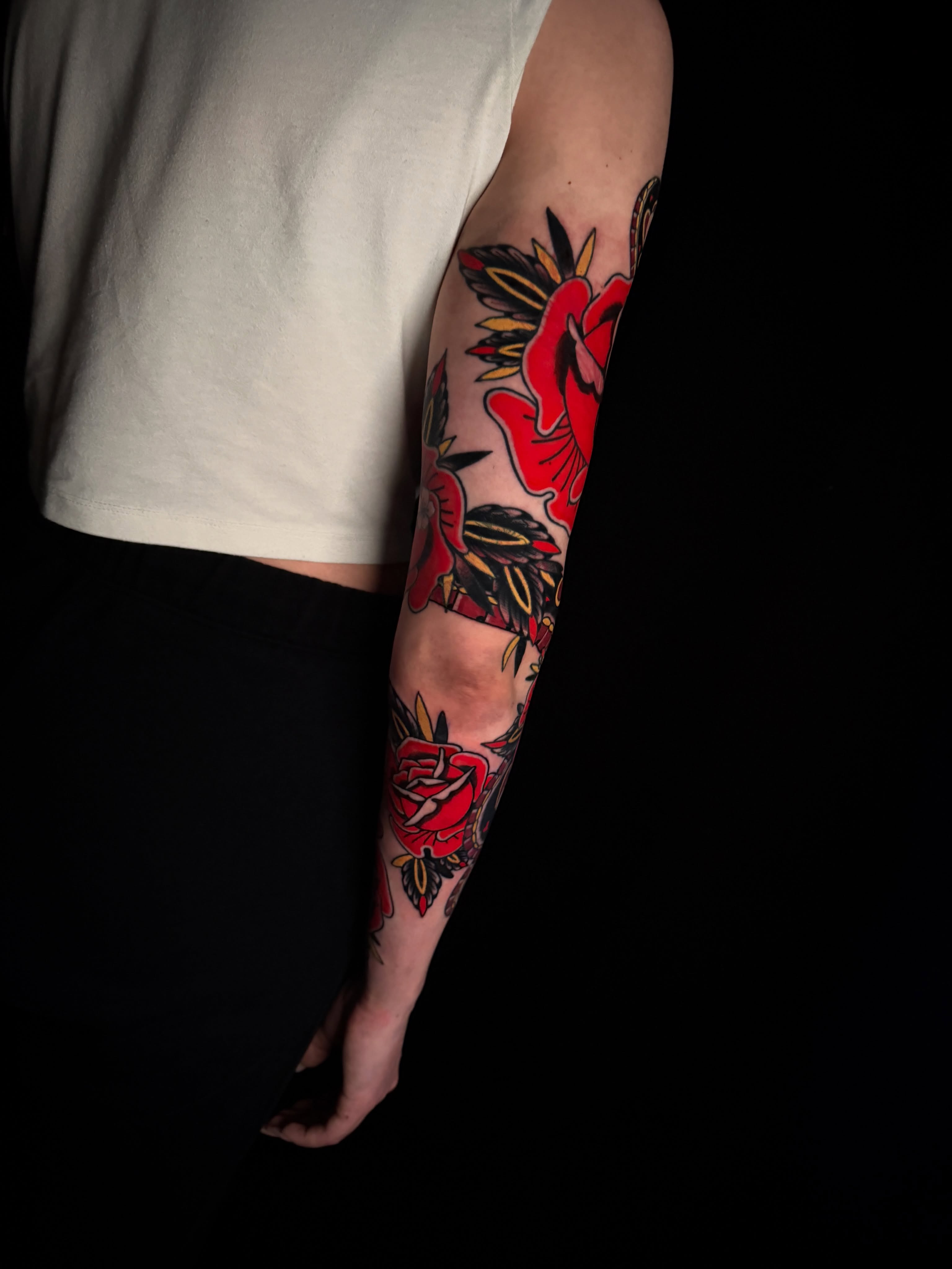 Roses American traditional tattoo on the forearm by Brad Snow