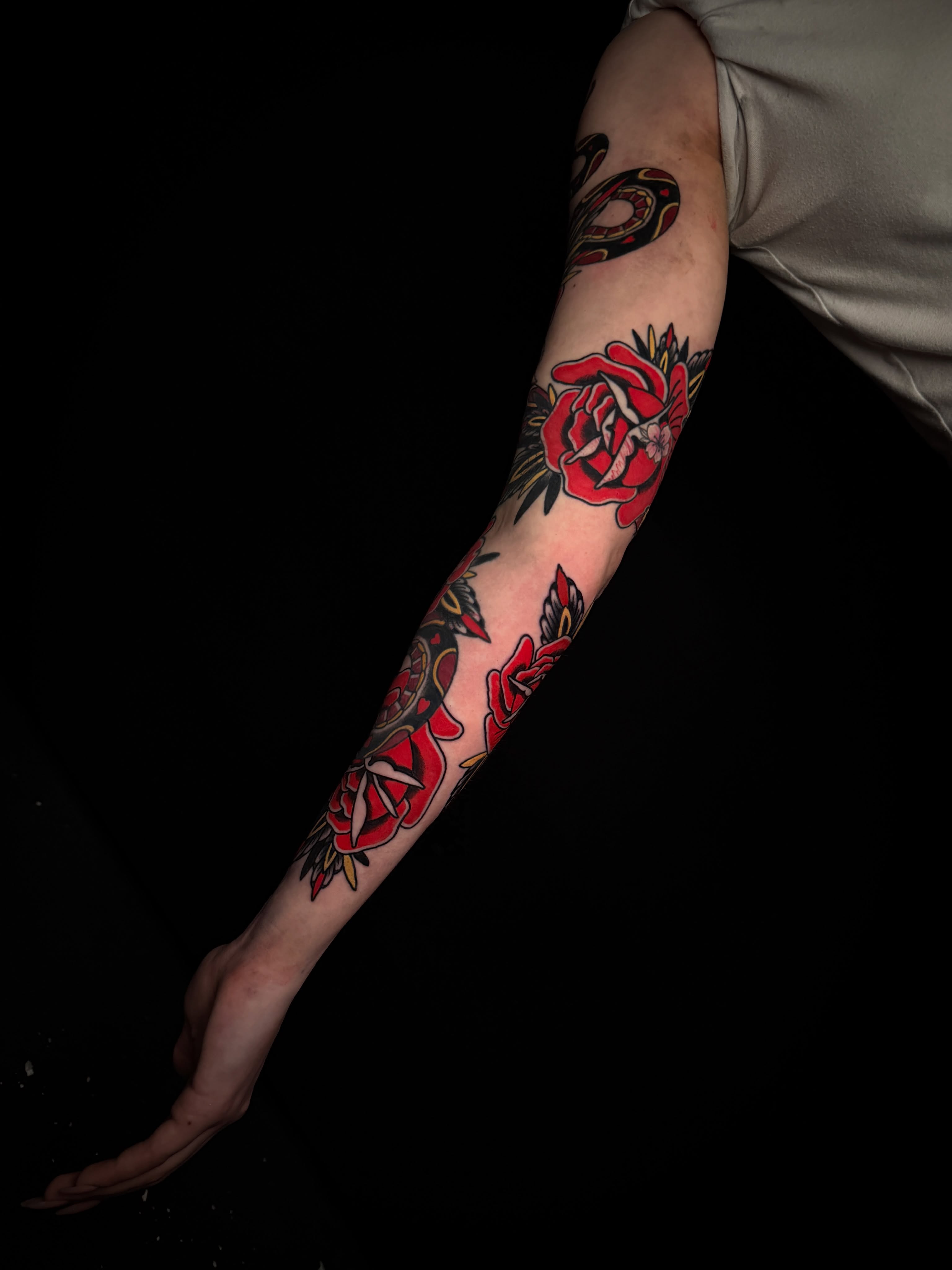 Roses American traditional tattoo on the forearm by Brad Snow