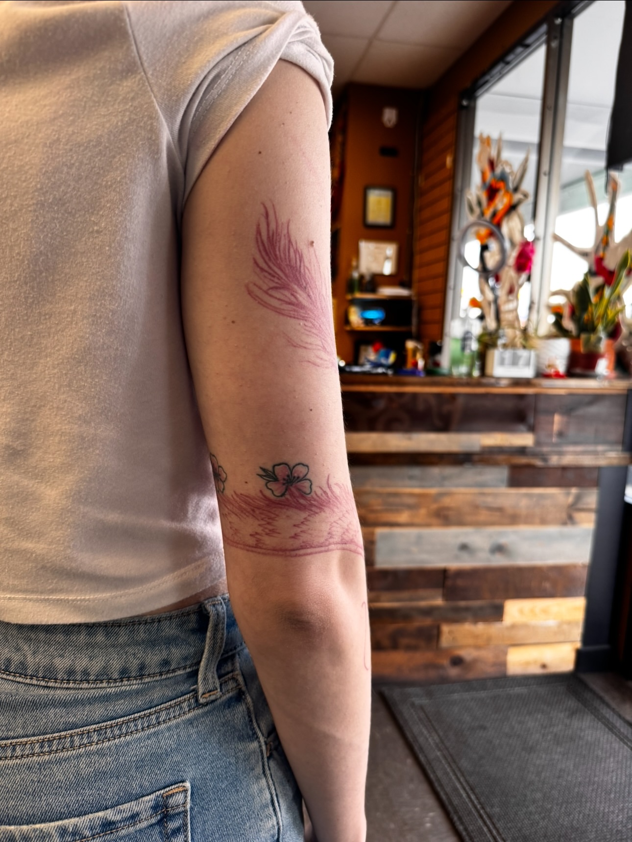 Flower American traditional tattoo on the forearm by Brad Snow